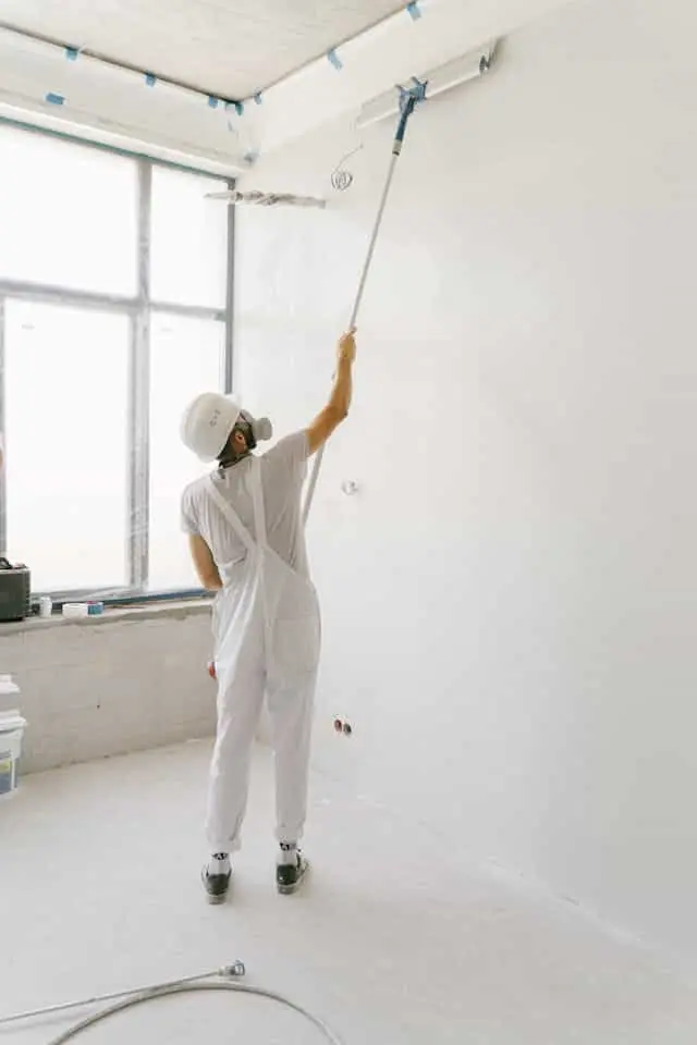 man painting a room