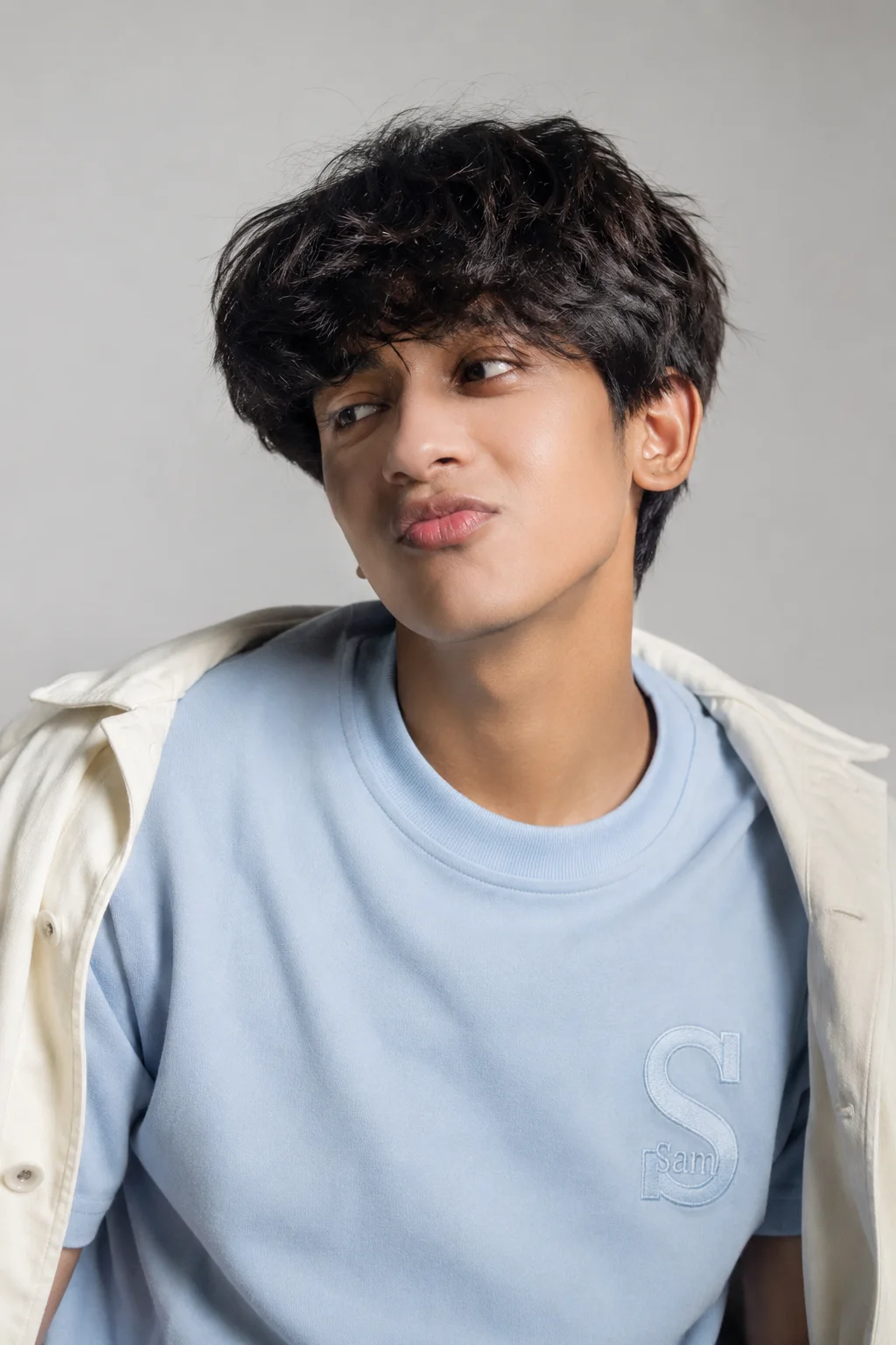 Playful Young Man in Soft Studio Light