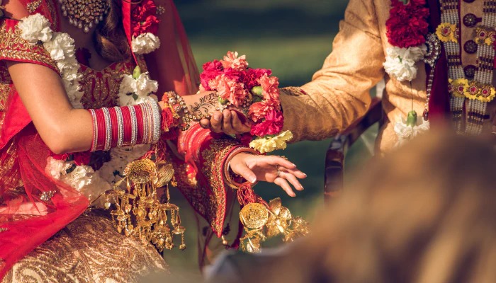 A candid, joyful moment at an Indian wedding.