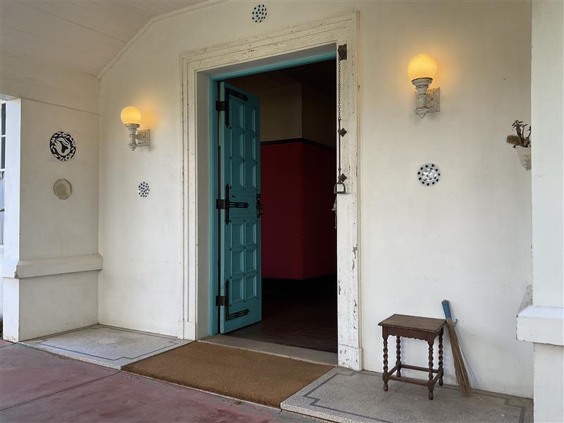 Straight-on view through the turquoise double doors