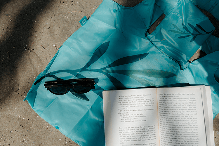 Beach read by the sea