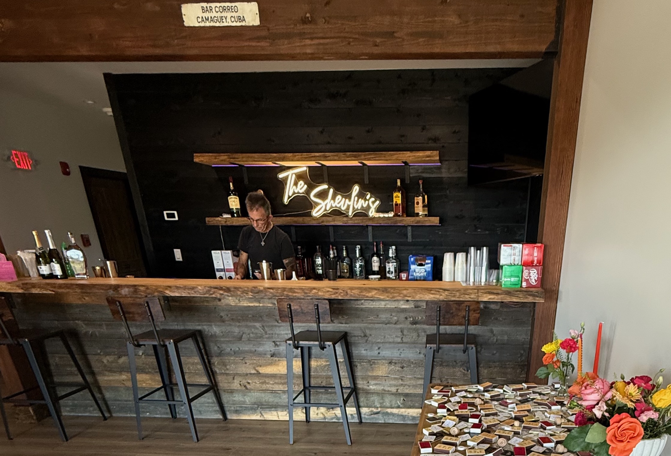 Custom bar with neon sign at Mountain Meadows Catskills wedding venue Long Eddy NY