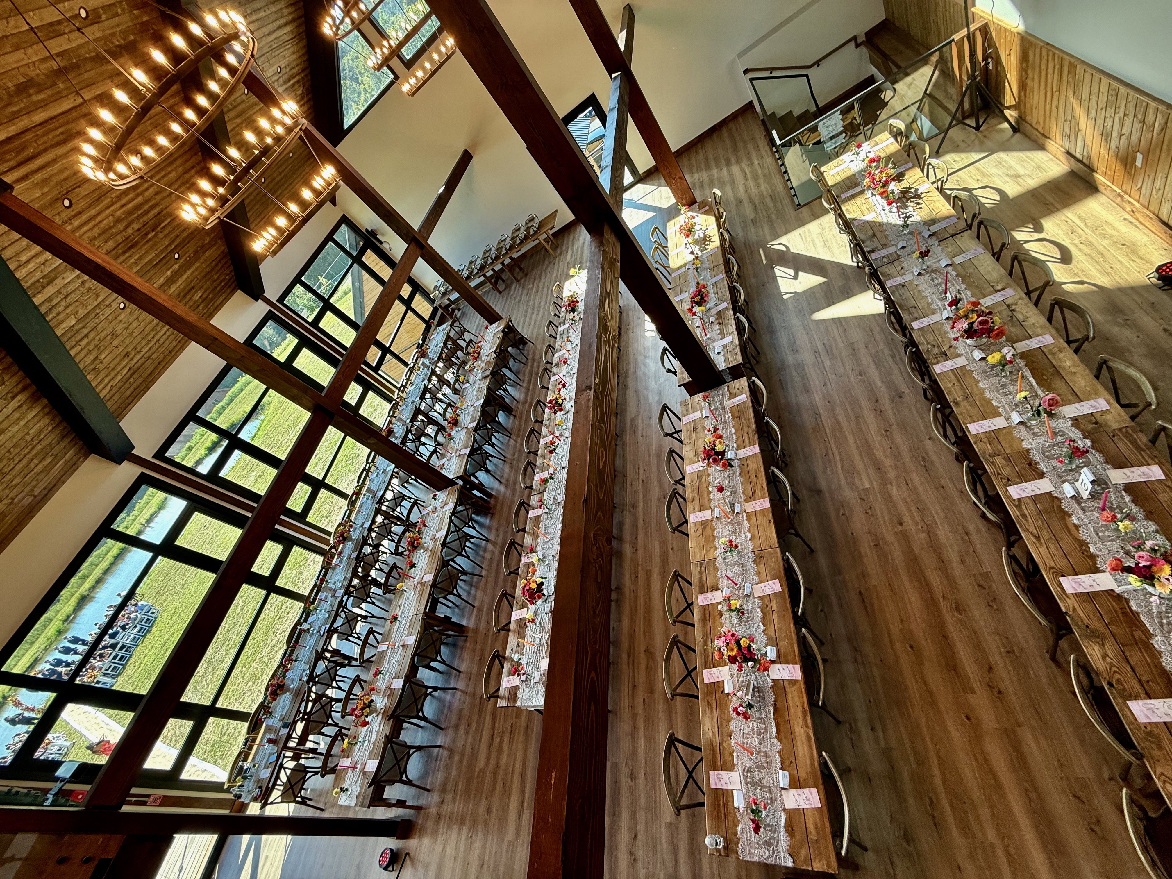 Aerial view of barn wedding reception tables at Mountain Meadows Catskills destination wedding venue