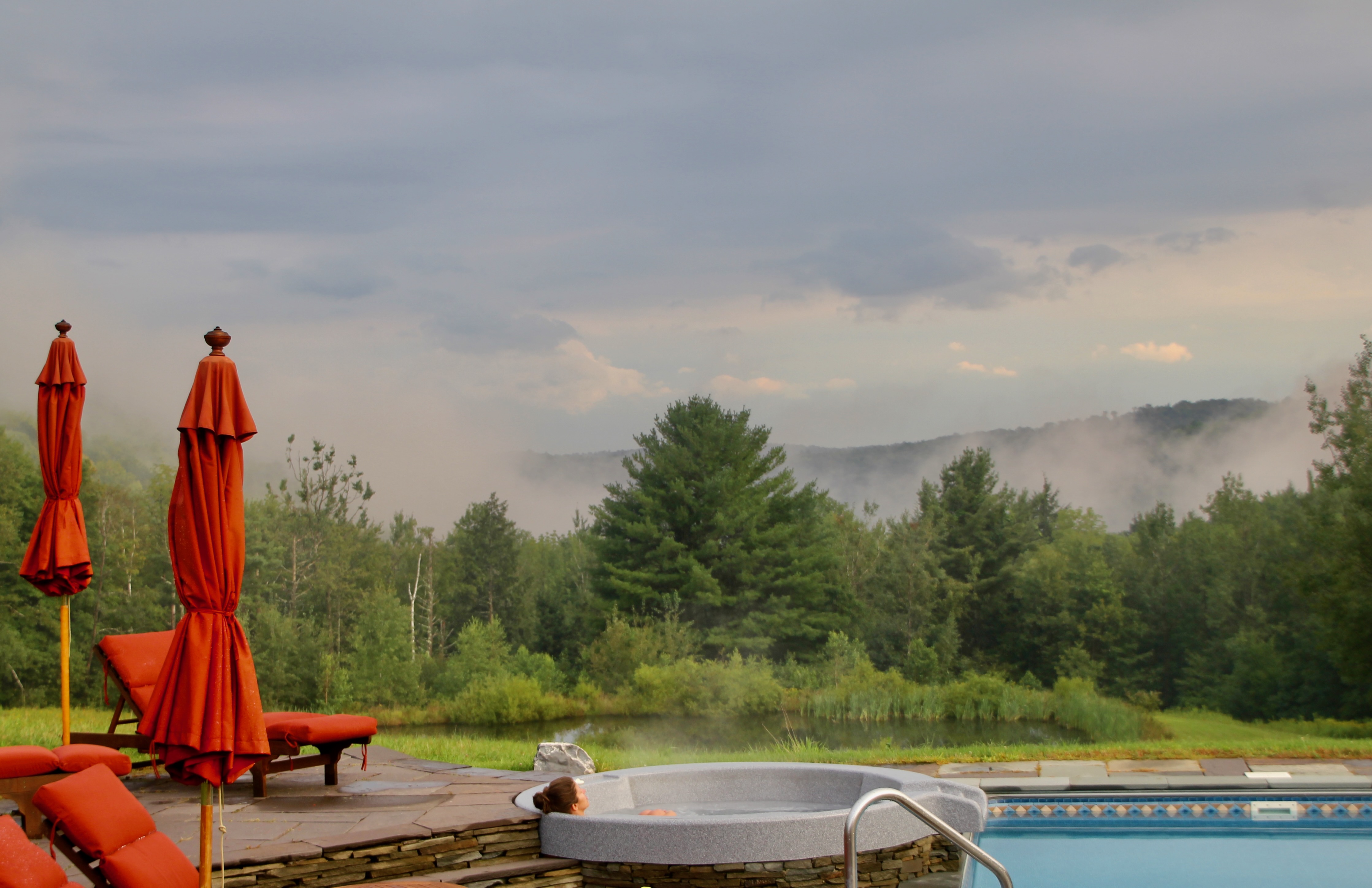 Hot tub in morning mountain mist at Mountain Meadows private Catskills wedding venue and resort