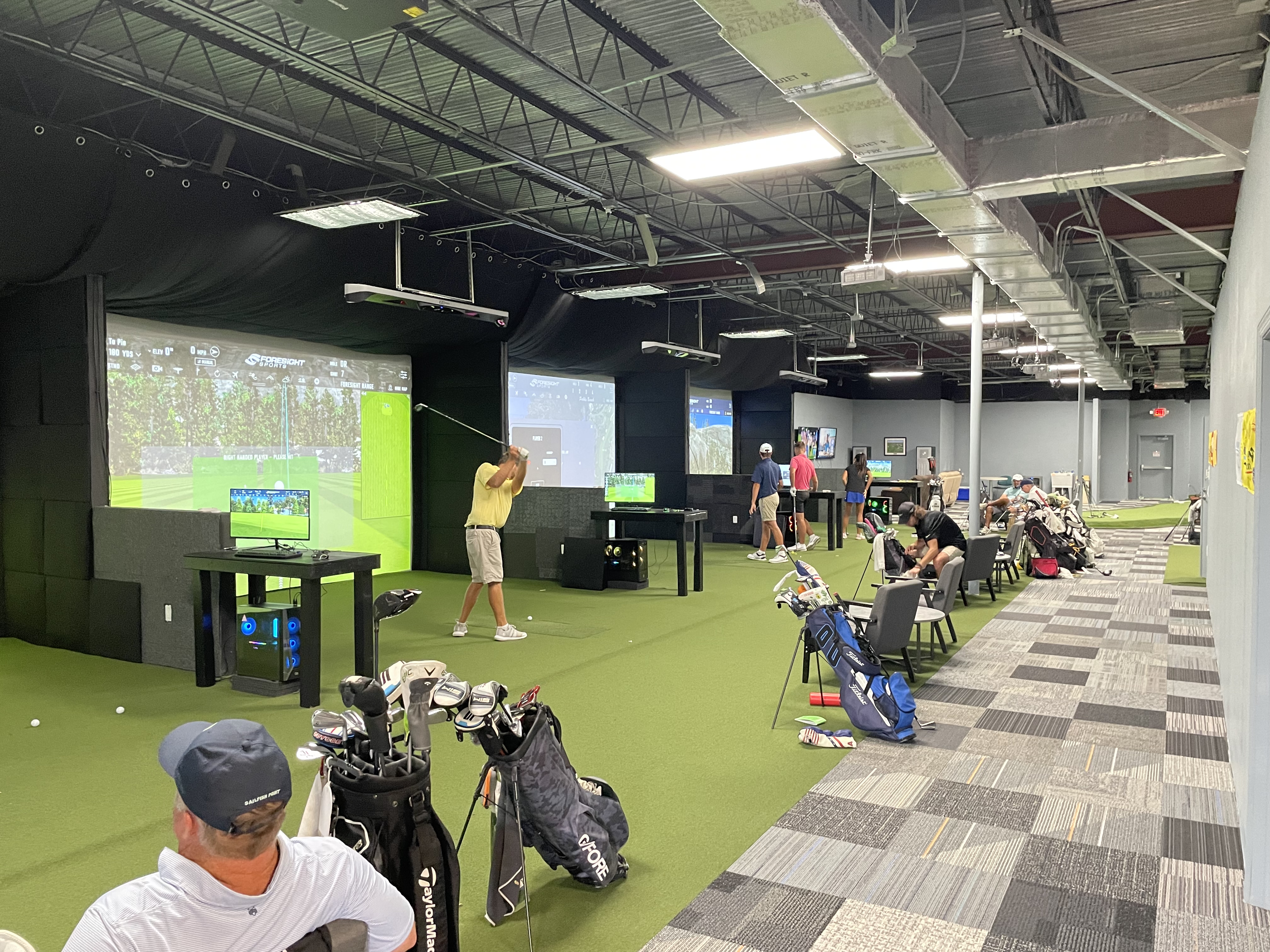 Members practicing at 247 Indoor Golf