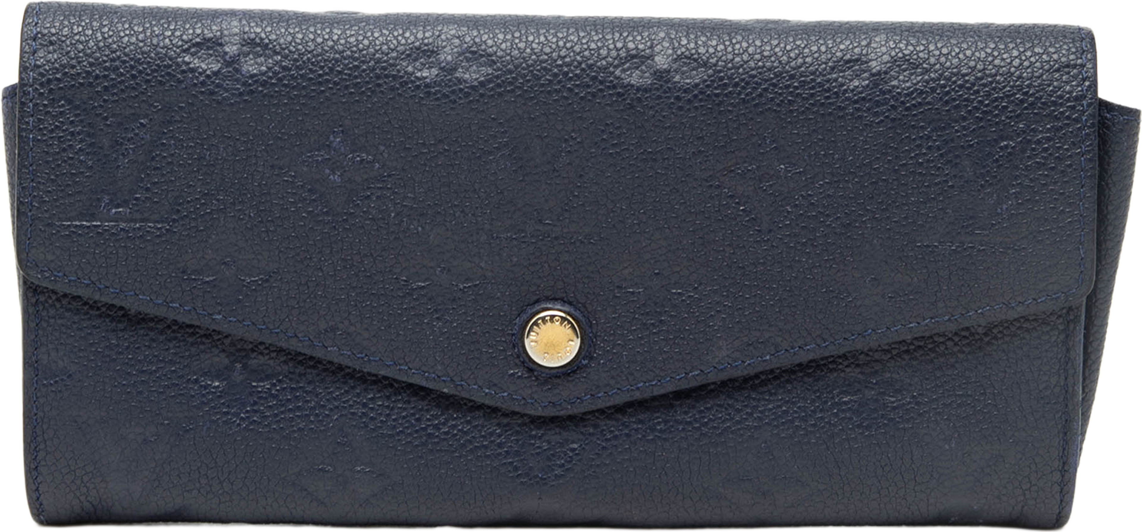 Louis Vuitton Monogram Empreinte Curieuse Wallet, från Luxclusif, i färgen navy. Klicka för att öppna bilden i stort format