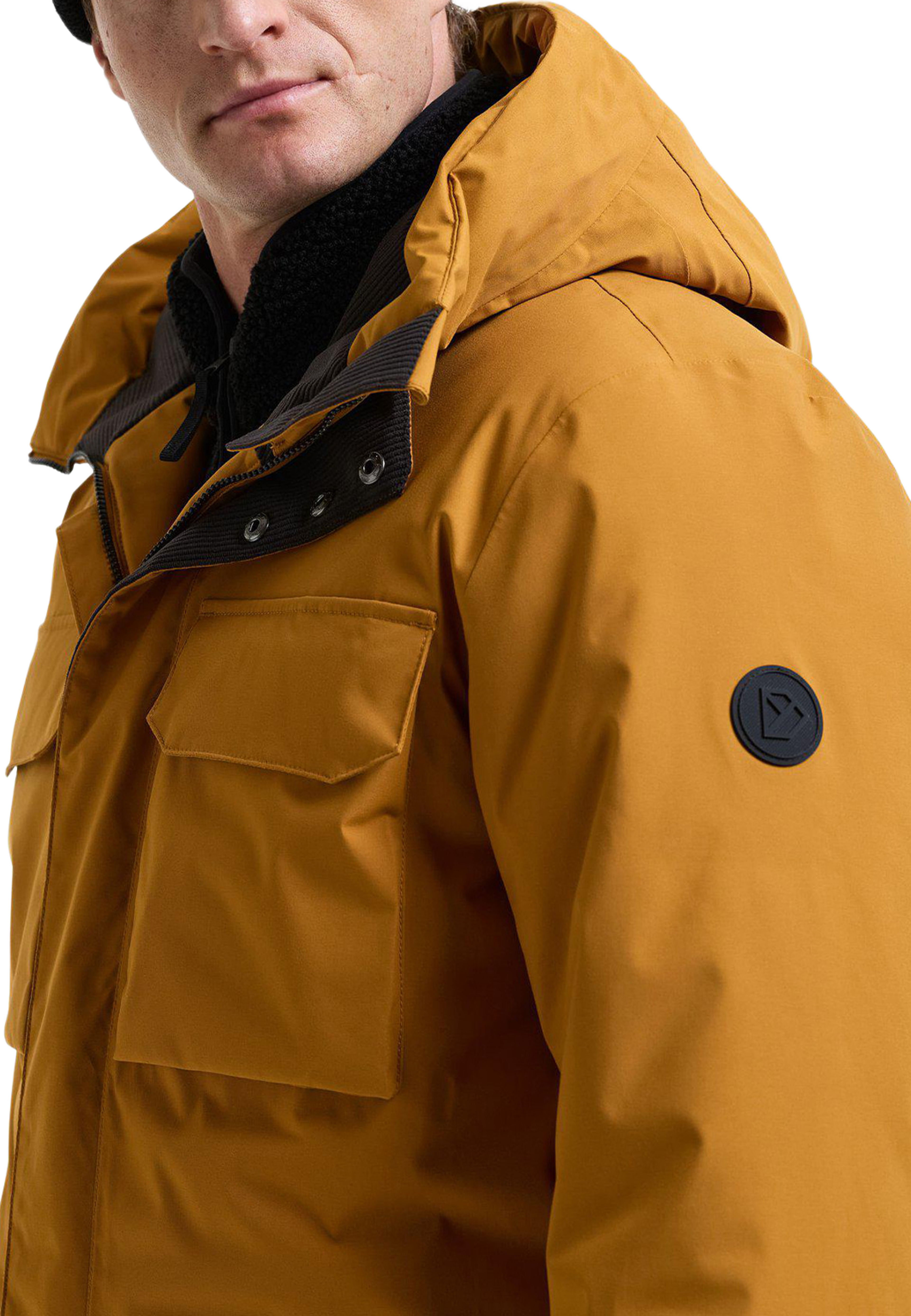 Aiden Parka 2, från Didriksons, i färgen Spice Brown. Klicka för att öppna bilden i stort format