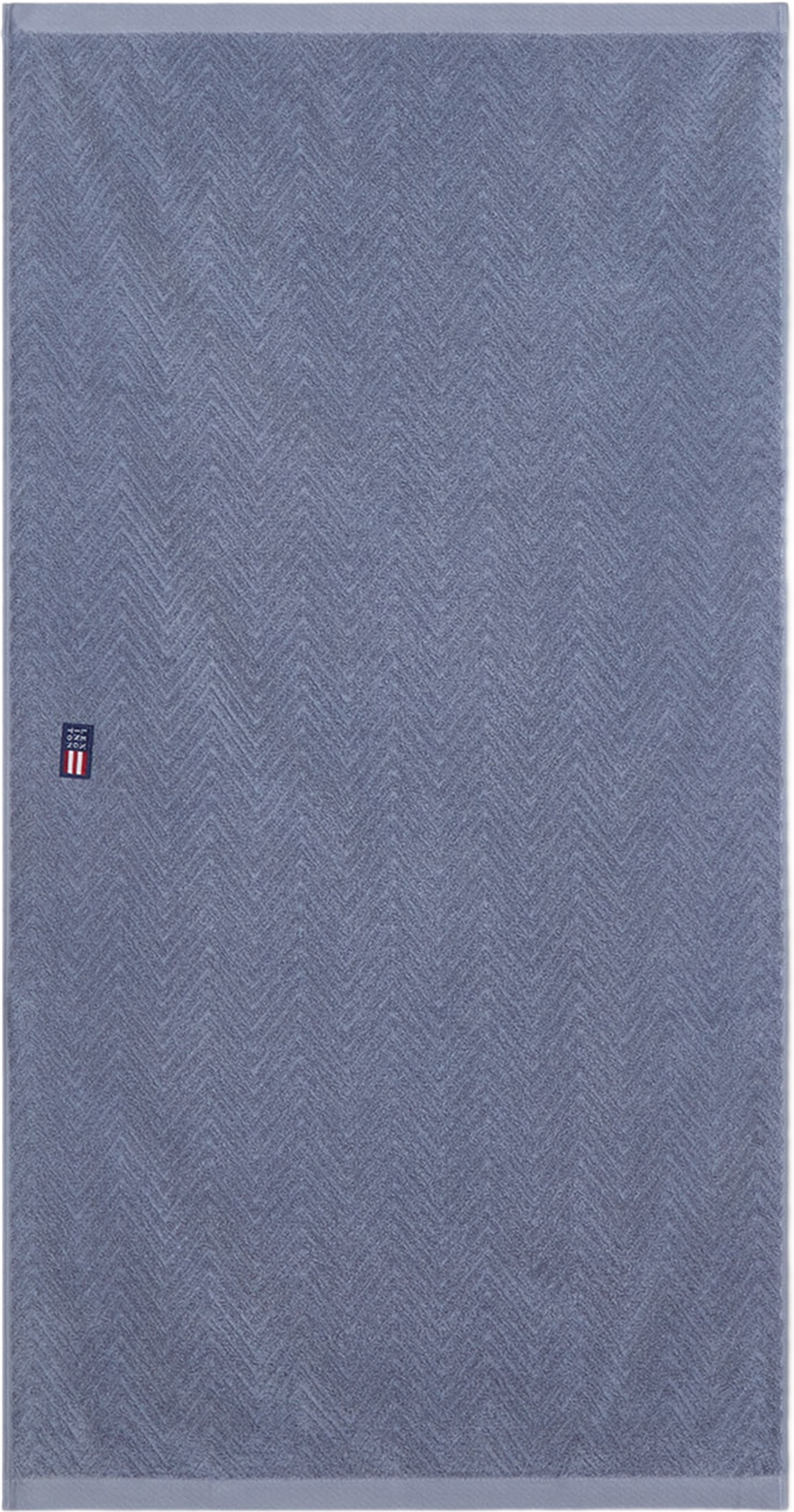 Herringbone Towel Steel Blue, från Lexington, i färgen Steel Blue.