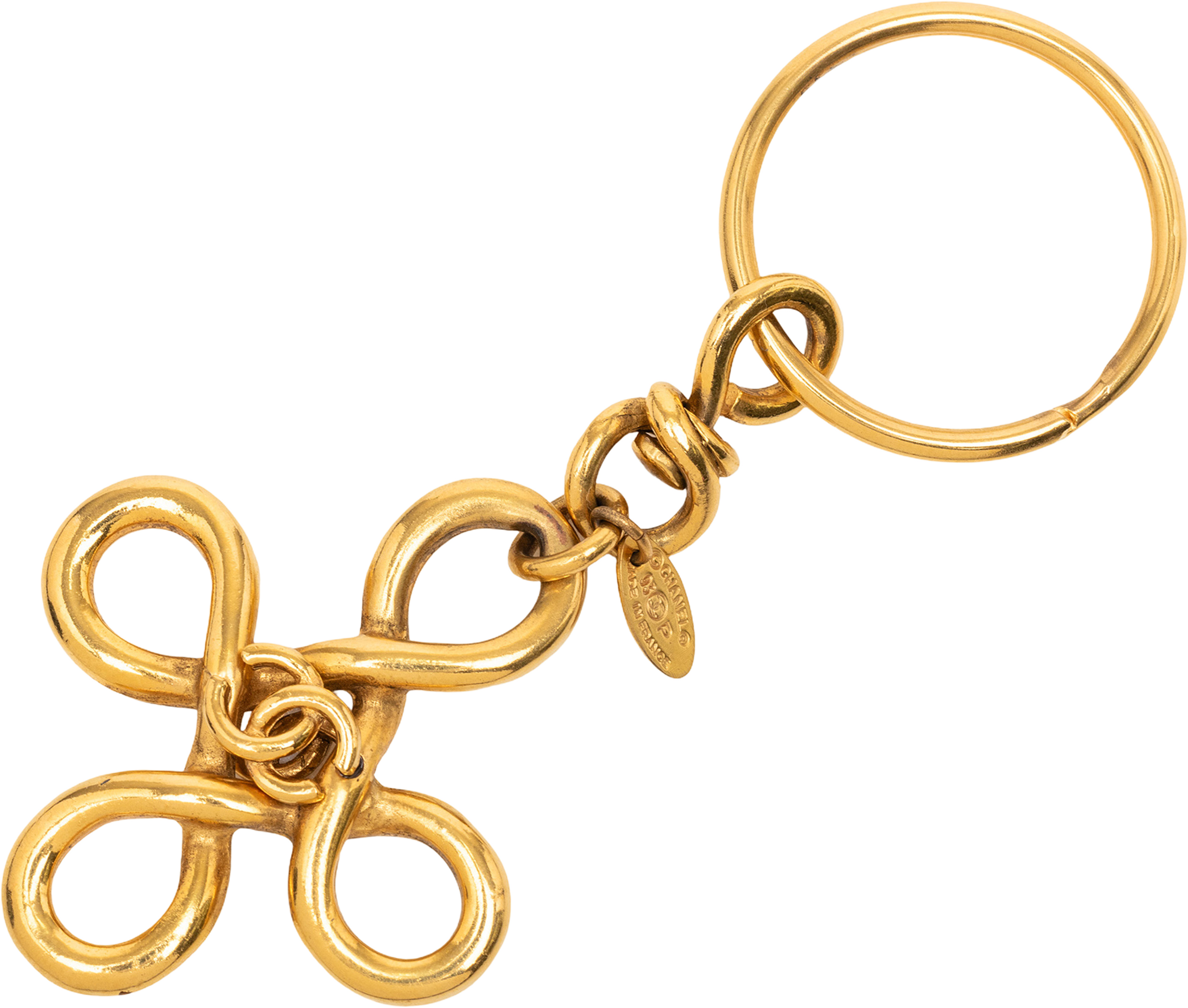 Chanel Gold Plated Cc Clover Cross Keychain, från Luxclusif, i färgen gold. Klicka för att öppna bilden i stort format