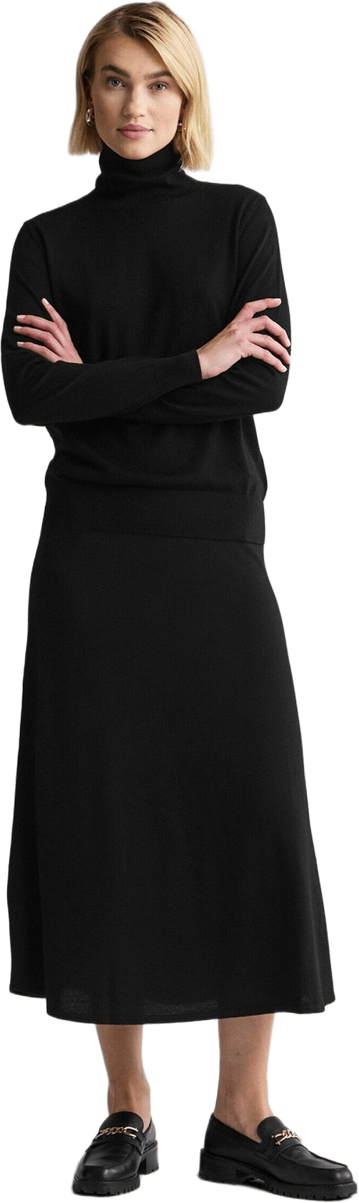 Stickad Polotröja Siri, från Newhouse, i färgen svart.