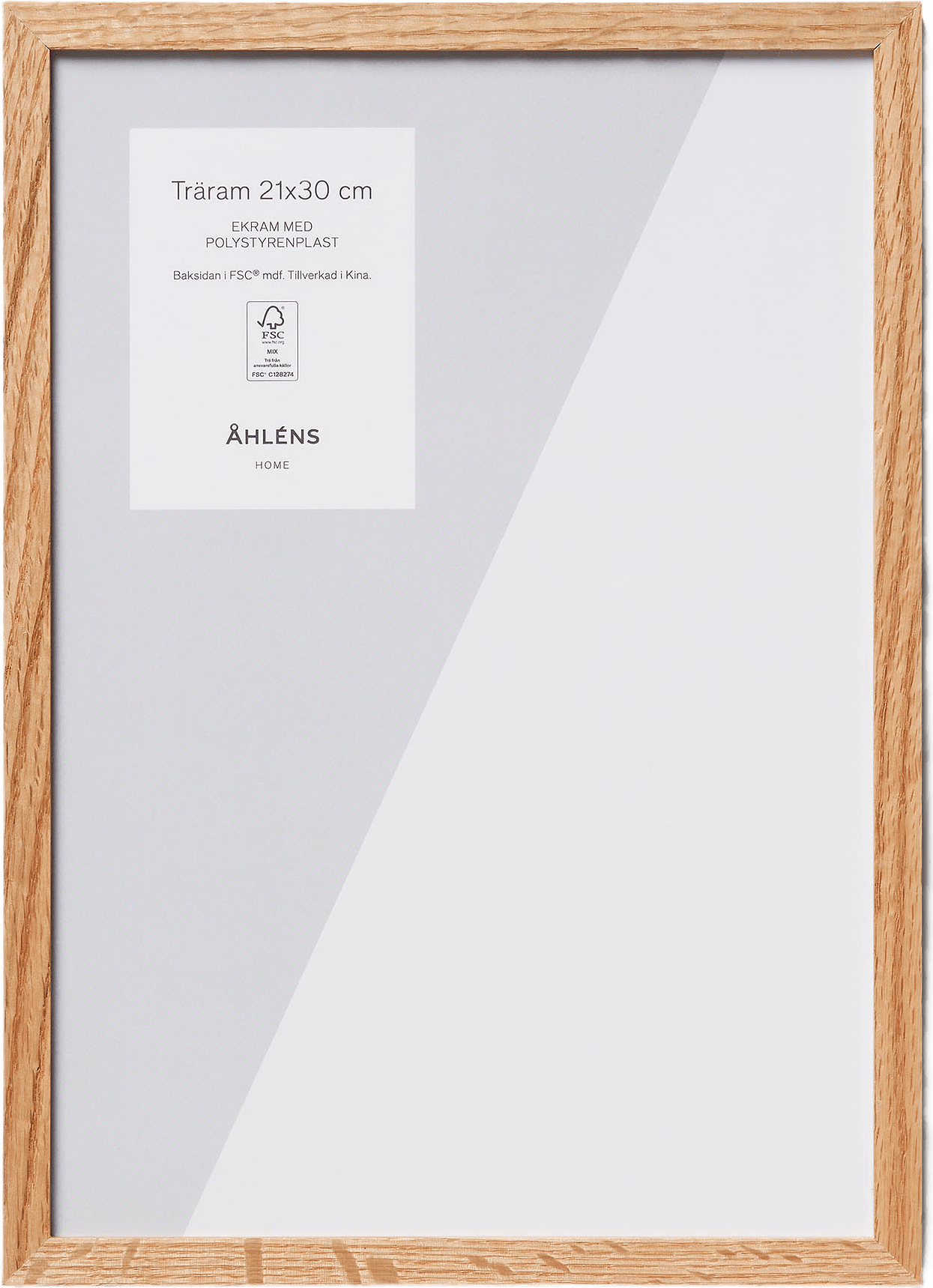 Ram i ekträ 21x30 cm, från Åhléns Home, i färgen oak wood.