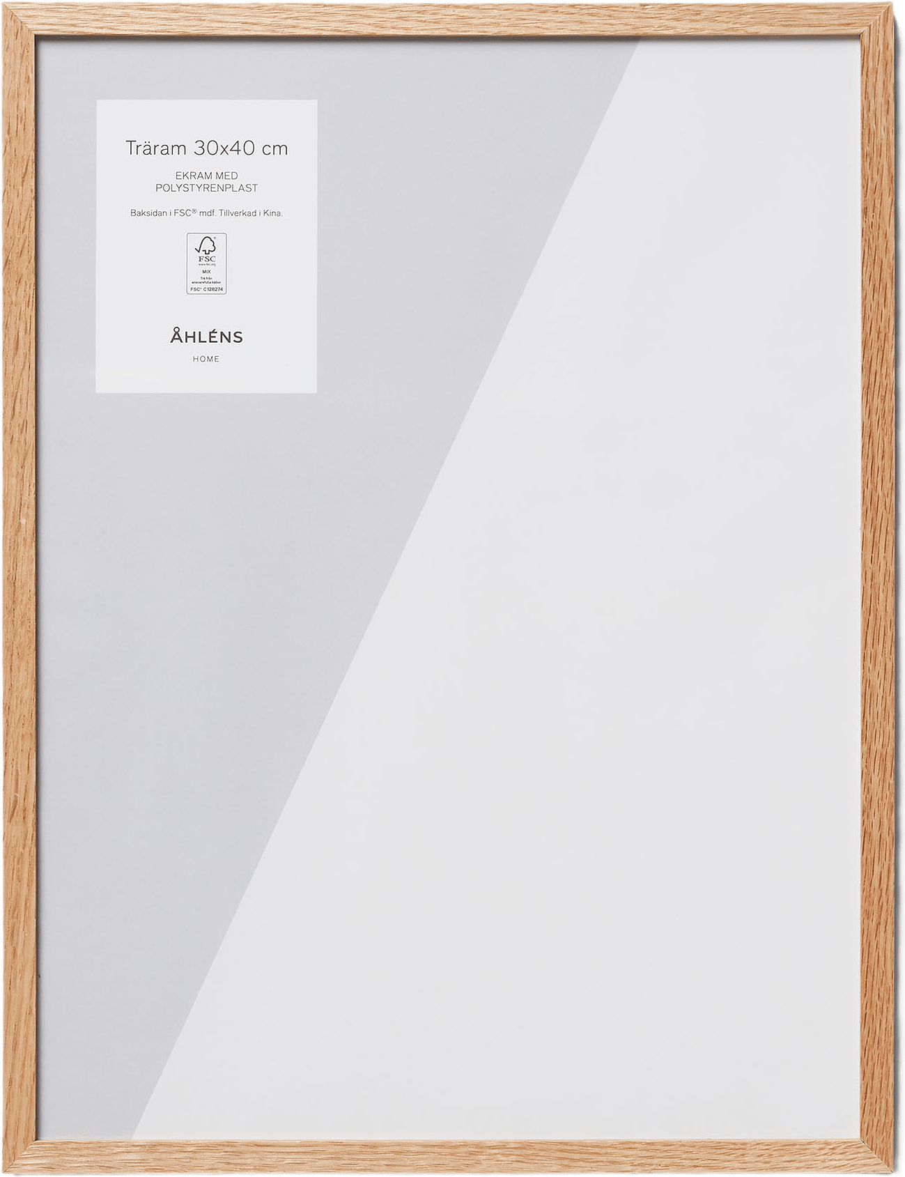 Ram i ekträ 30x40 cm, från Åhléns Home, i färgen oak wood.