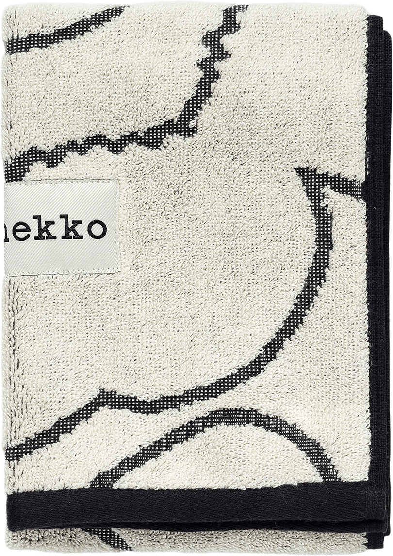 Piirto Unikko Guest Towel30X50, från Marimekko, i färgen Ivory, Black.