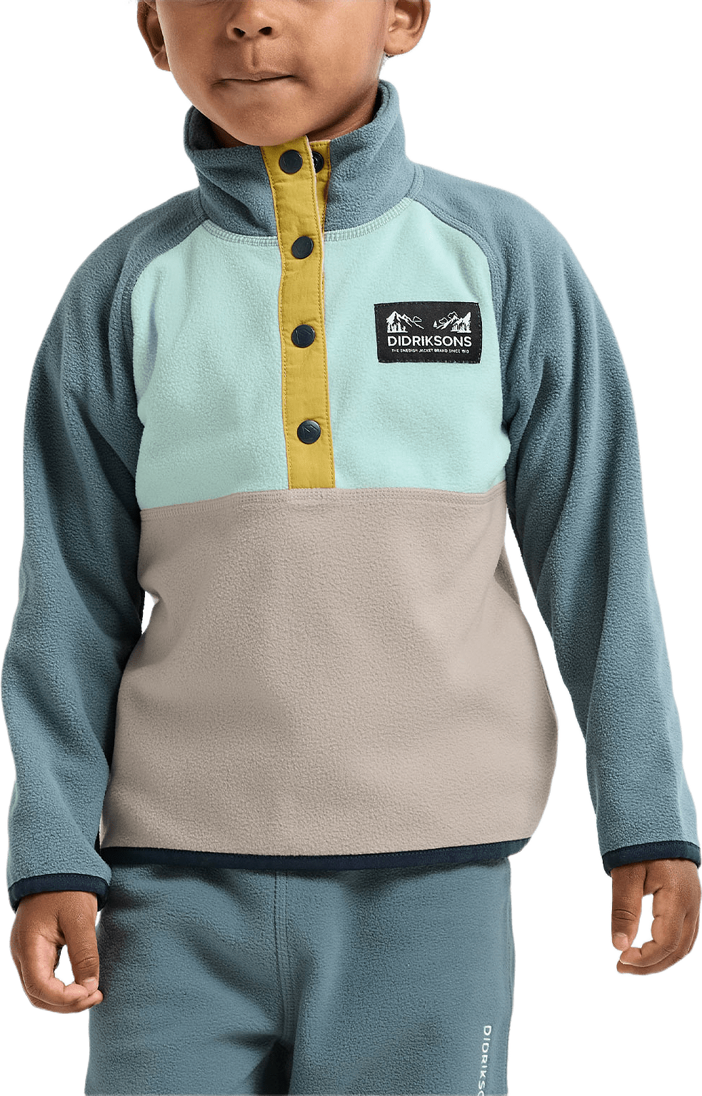 Monte Half button, från Didriksons, i färgen Ocean Mint.