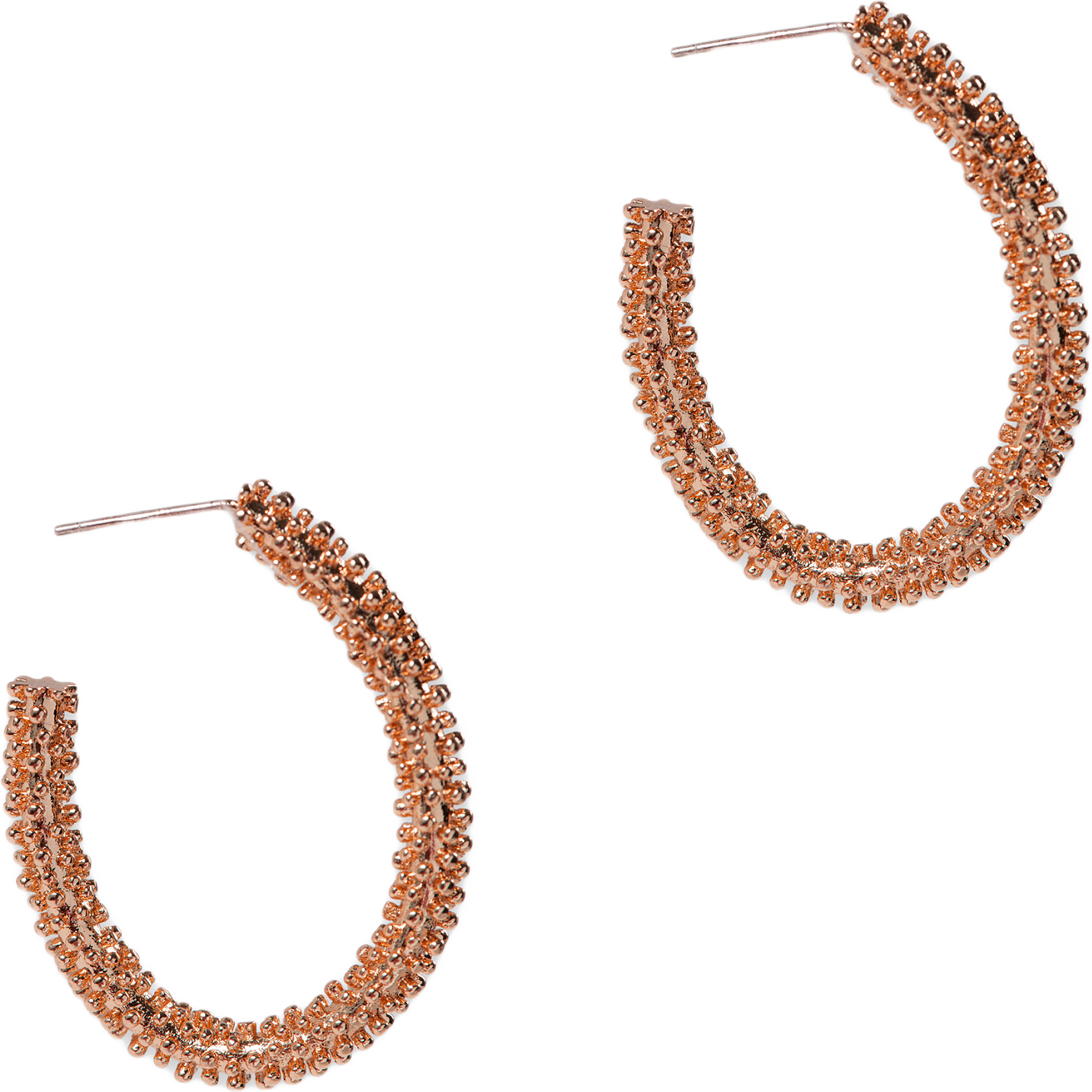 Dottie Oval Hoop, från pfgSTOCKHOLM, i färgen rose gold.