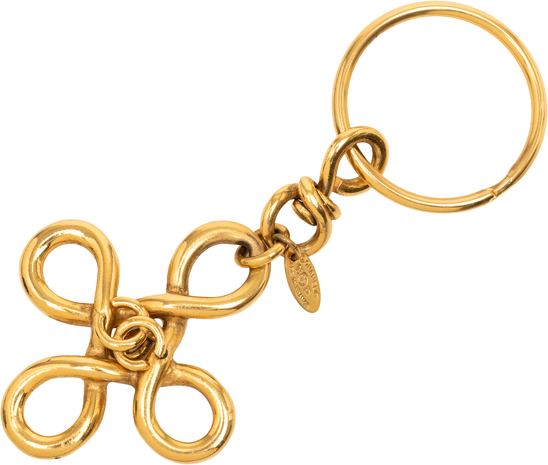 Chanel Gold Plated Cc Clover Cross Keychain, från Luxclusif, i färgen gold.