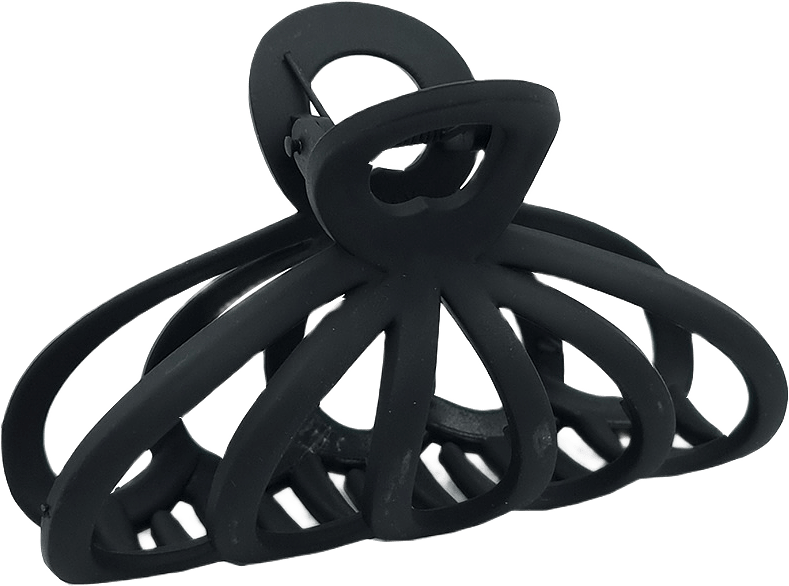 Större hårklämma i gummi, från Complement, i färgen black.