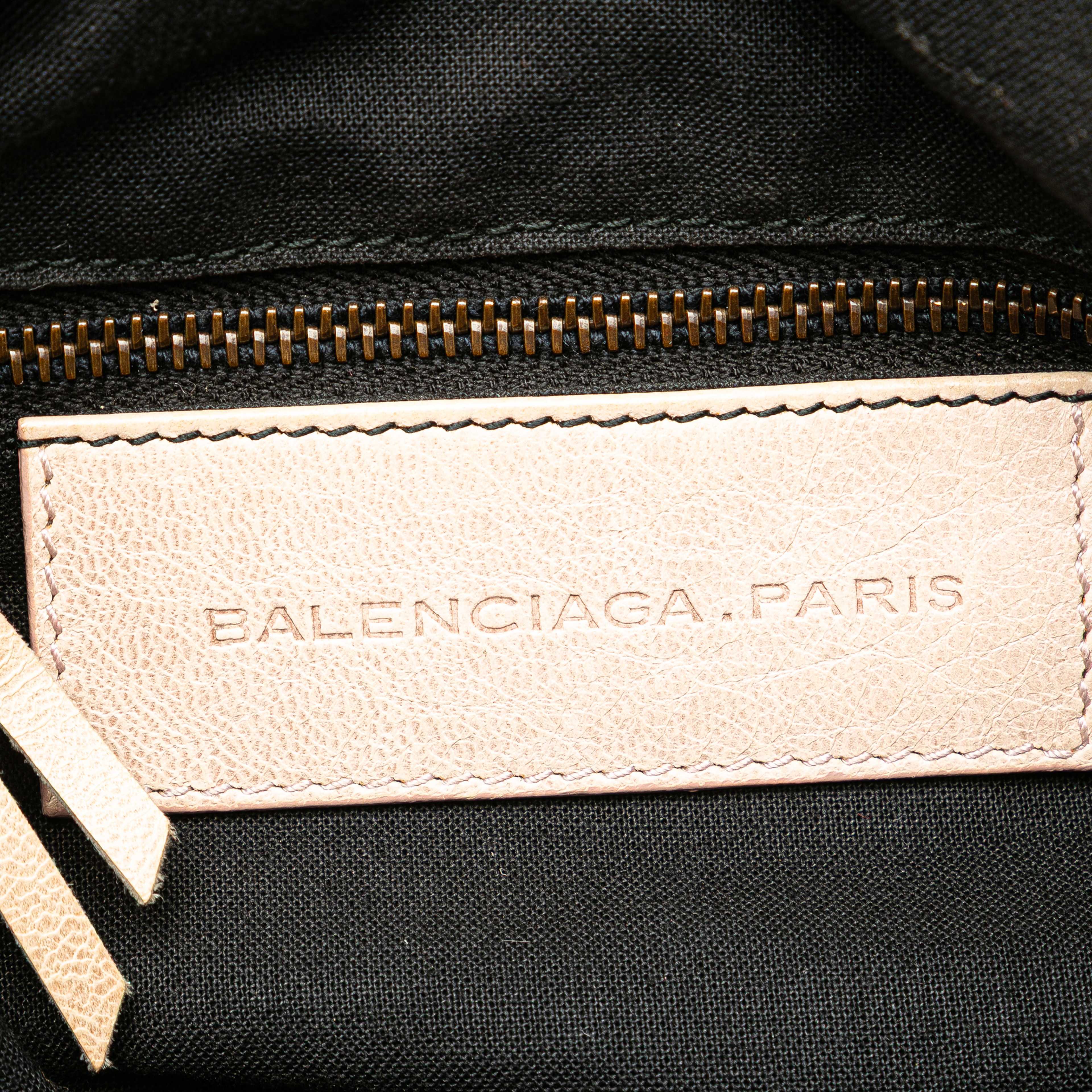 Balenciaga Mini Lambskin Motocross Pompon Bag, från Luxclusif, i färgen light beige. Klicka för att öppna bilden i stort format