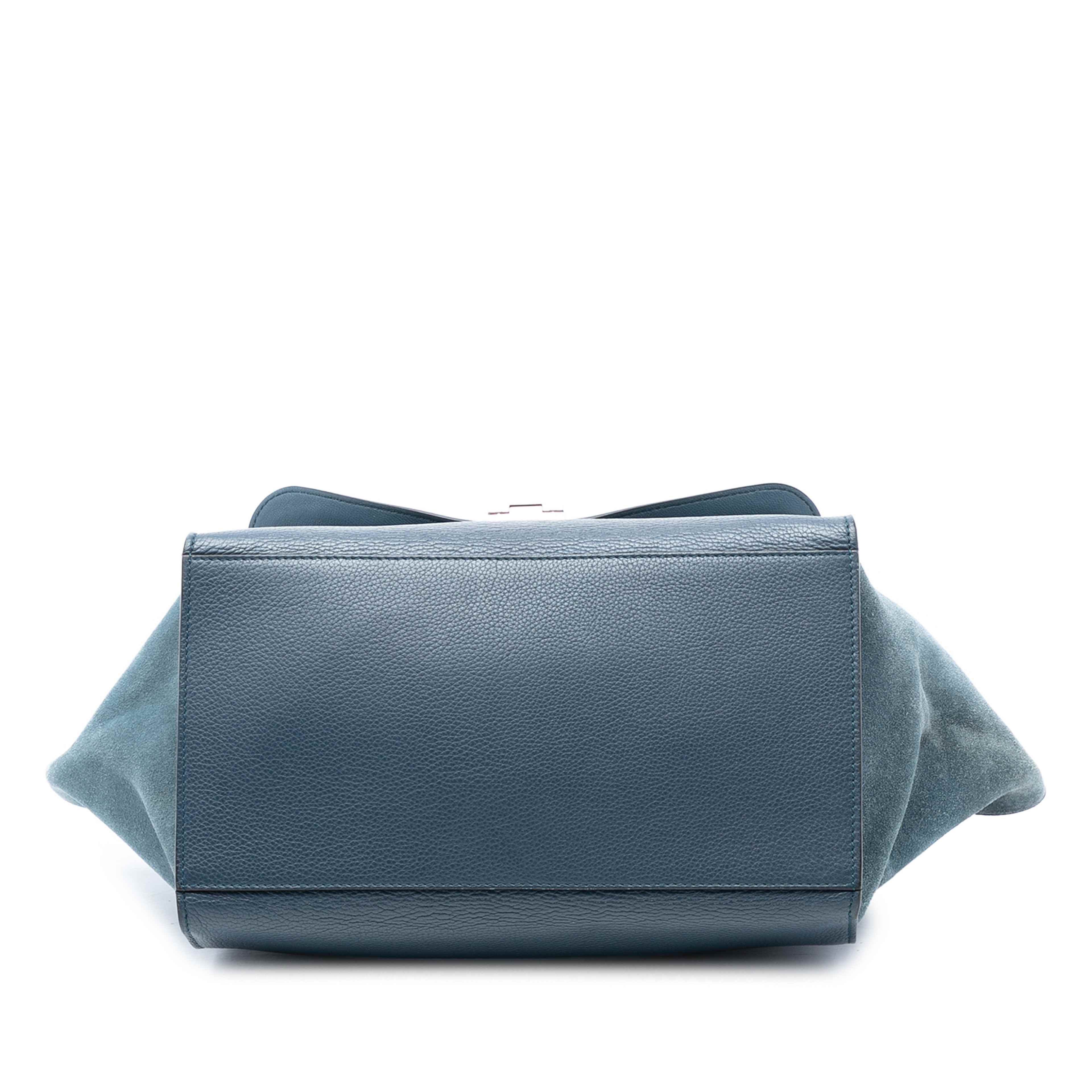 Celine Medium Calfskin And Suede Trapeze Satchel, från Luxclusif, i färgen navy. Klicka för att öppna bilden i stort format