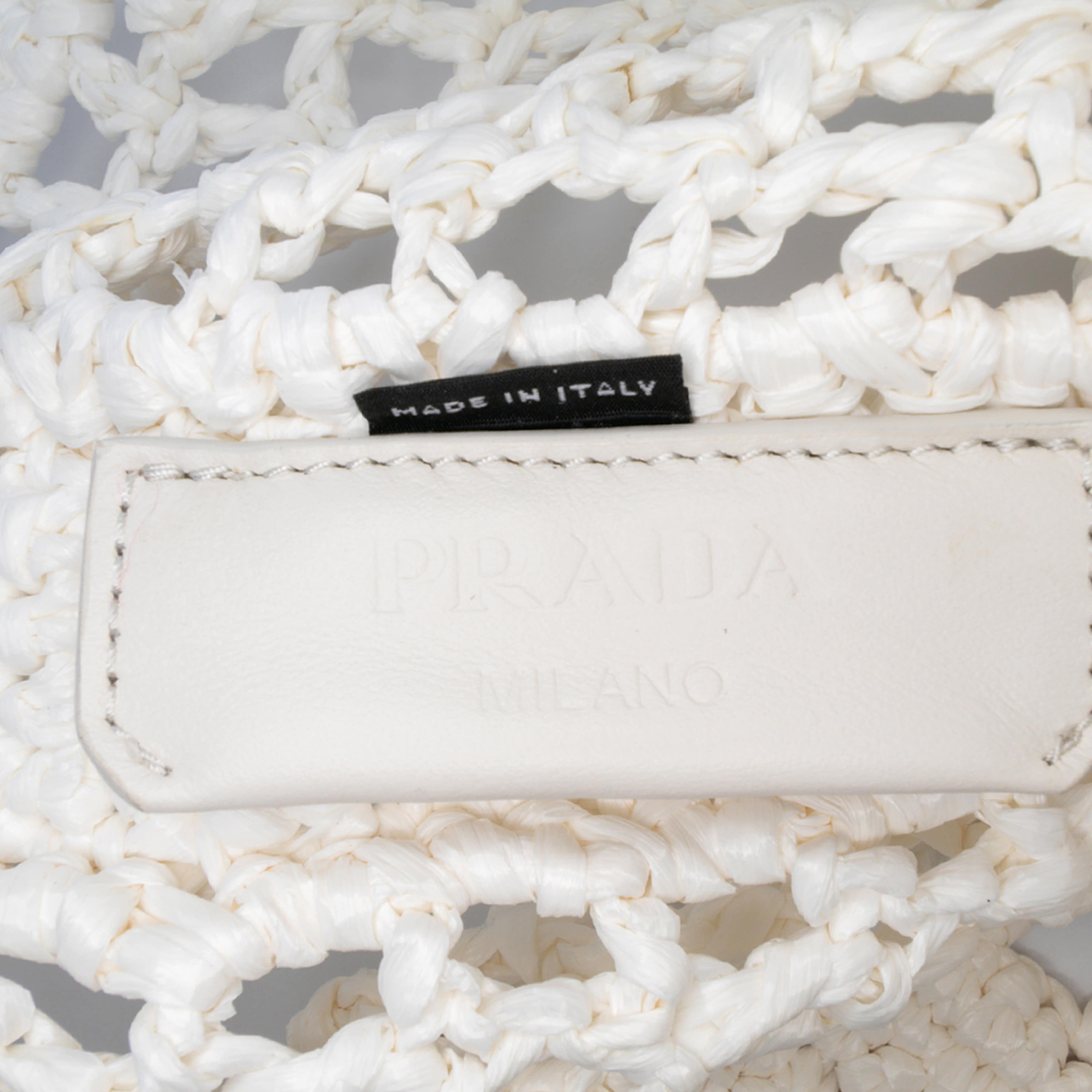 Prada Raffia Effect Crochet Logo Embroidered Tote, från Luxclusif, i färgen white. Klicka för att öppna bilden i stort format