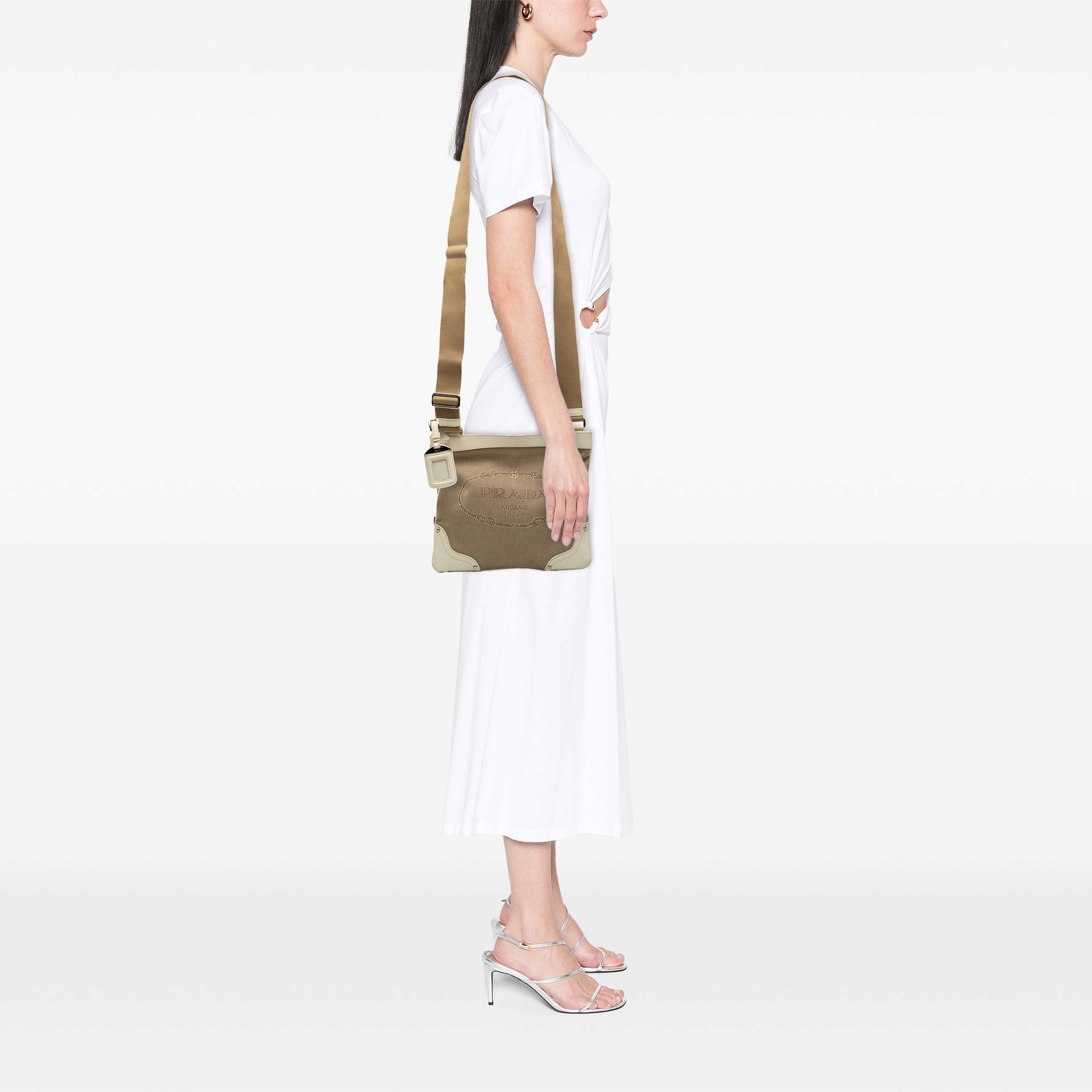 Prada Canvas Canapa Logo Crossbody, från Luxclusif, i färgen beige. Klicka för att öppna bilden i stort format