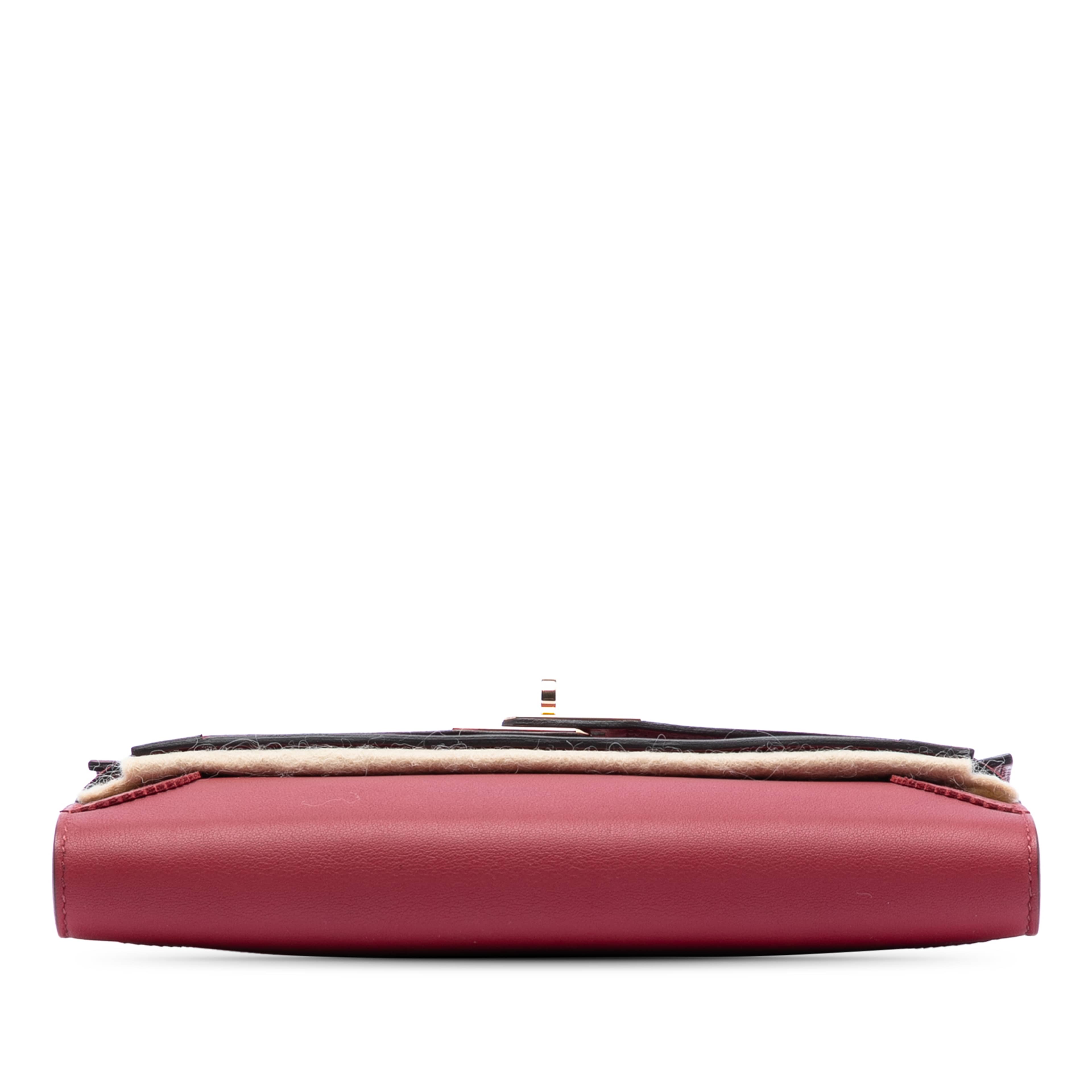 Hermès Swift Ghillies Kelly Longue Wallet, från Luxclusif, i färgen dark red. Klicka för att öppna bilden i stort format