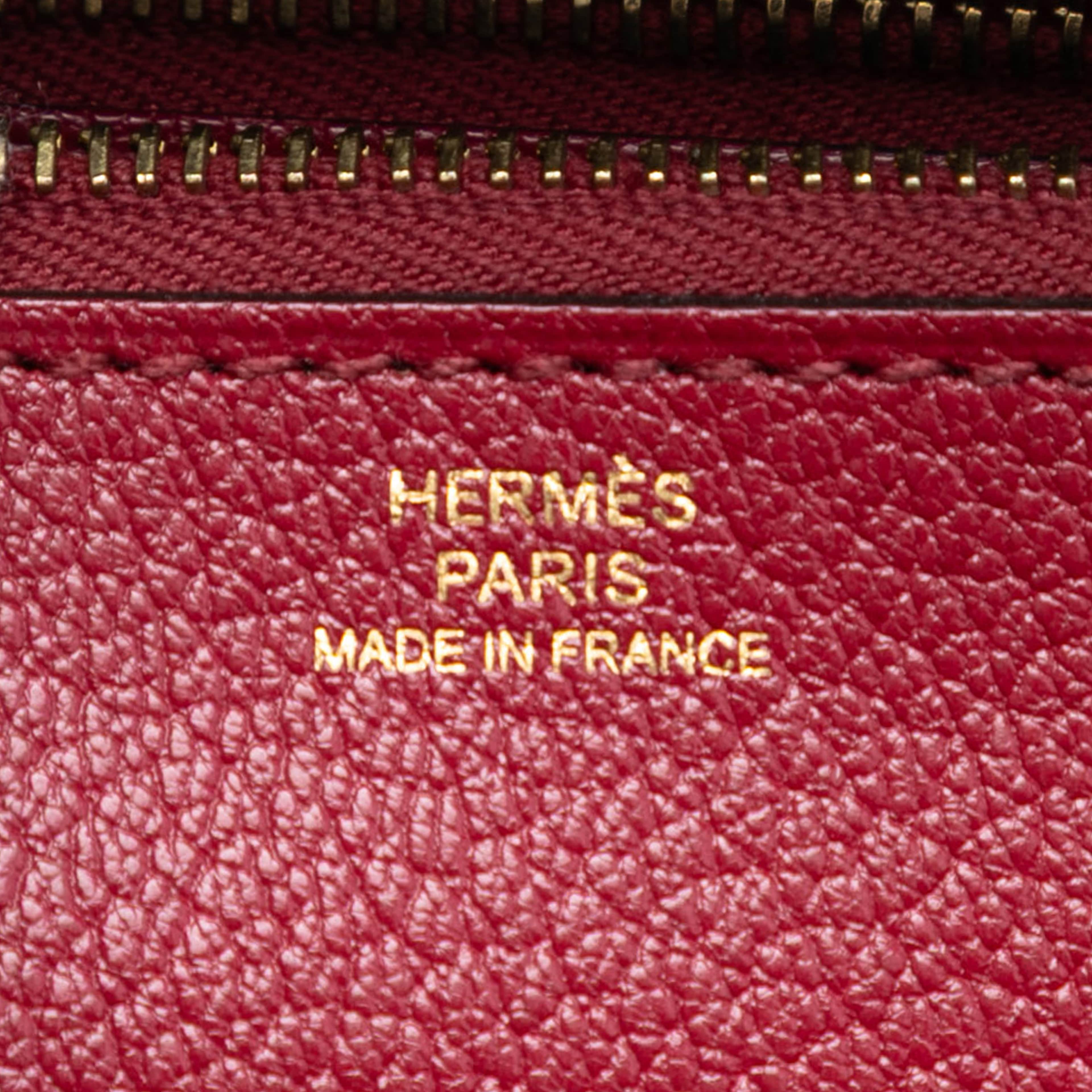 Hermès Swift Ghillies Kelly Longue Wallet, från Luxclusif, i färgen dark red. Klicka för att öppna bilden i stort format