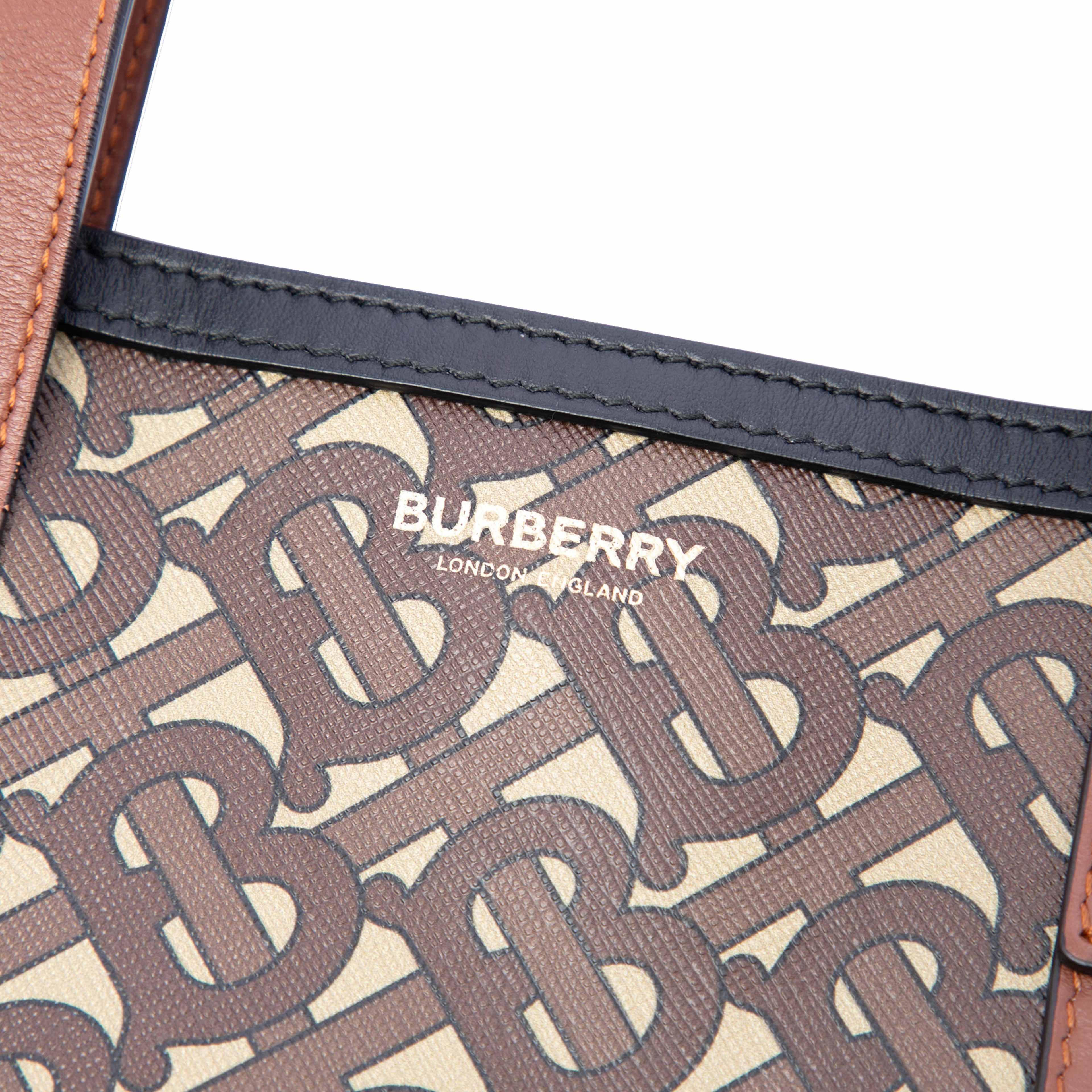 Burberry Tb Monogram E-canvas Stripe Vertical Tote, från Luxclusif, i färgen brown. Klicka för att öppna bilden i stort format