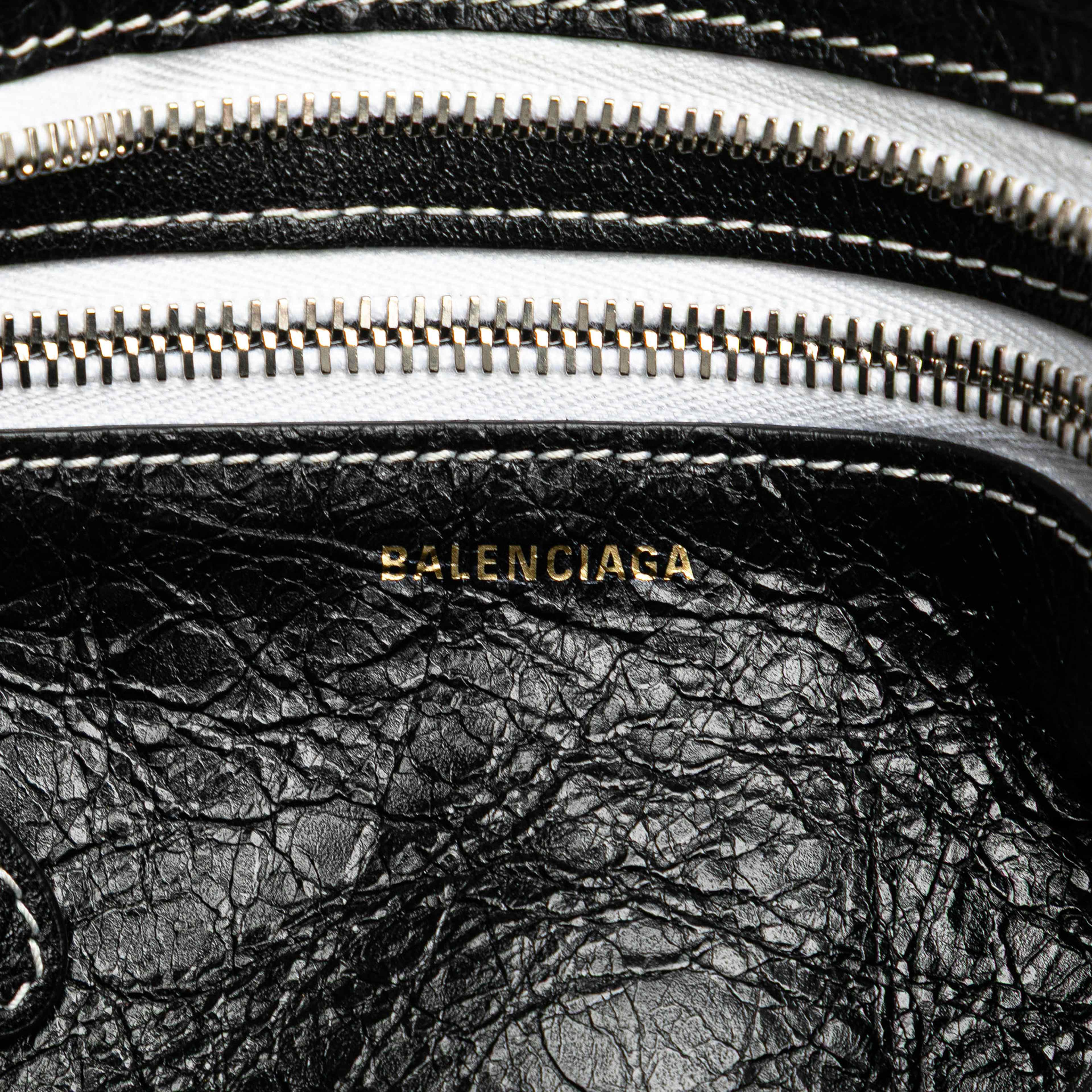 Balenciaga Small Lambskin Barbes Striped Patwork Zip Pouch, från Luxclusif, i färgen black.