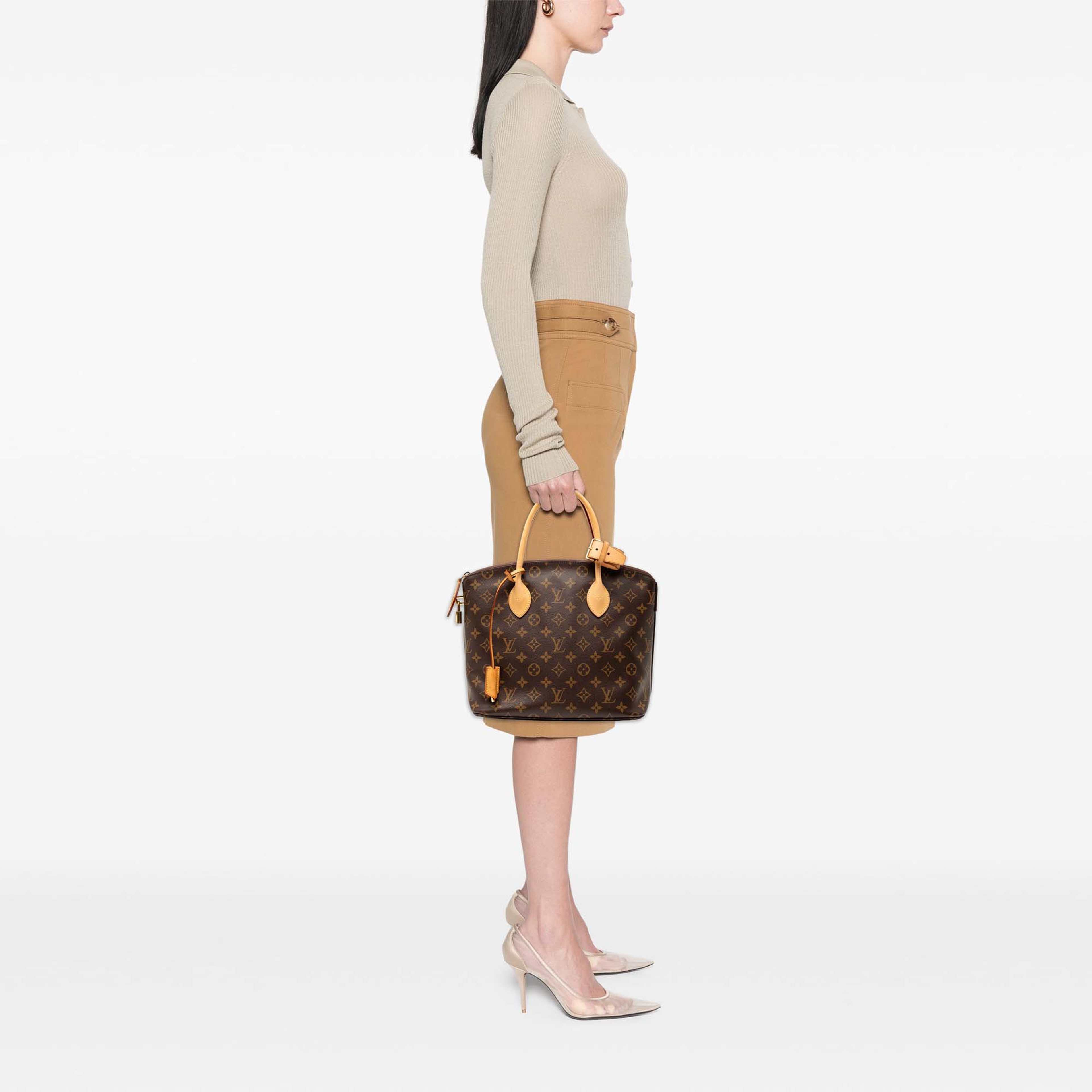 Louis Vuitton Monogram Lockit Pm, från Luxclusif, i färgen brun. Klicka för att öppna bilden i stort format
