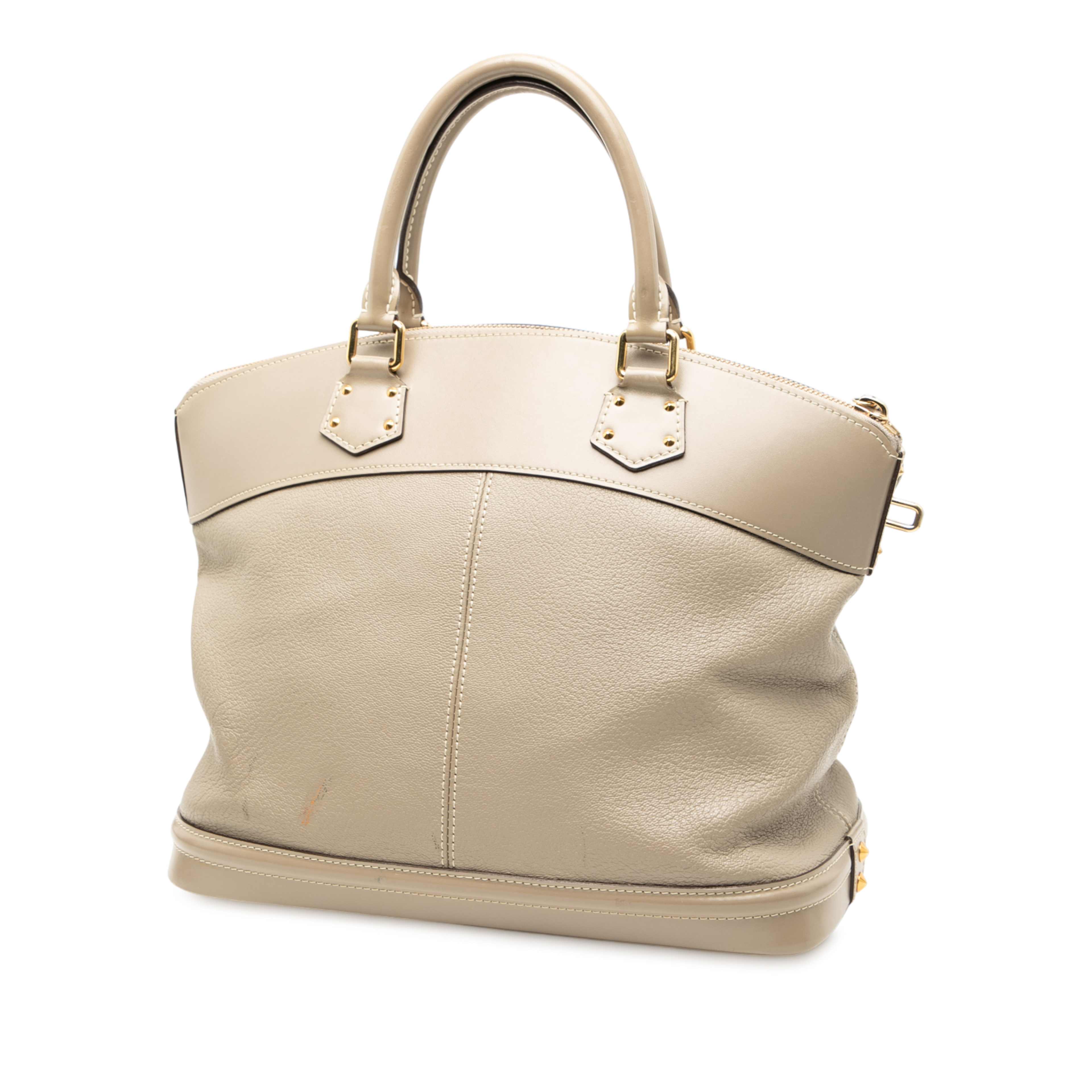 Louis Vuitton Suhali Lockit Mm, från Luxclusif, i färgen beige. Klicka för att öppna bilden i stort format