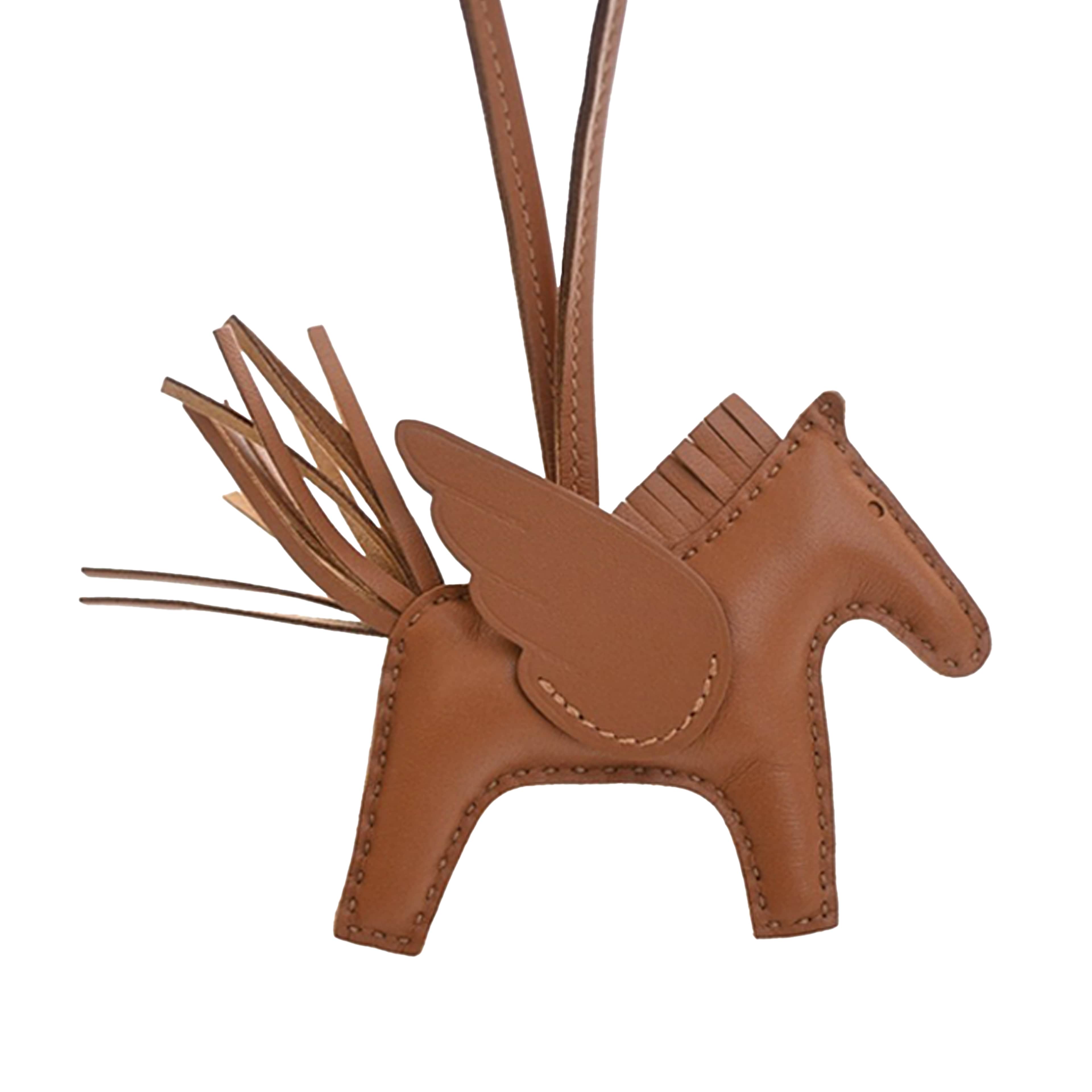 Hermès Milo Lambskin And Swift Grigri Rodeo Pegase Bag Charm Pm, från Luxclusif, i färgen brown. Klicka för att öppna bilden i stort format