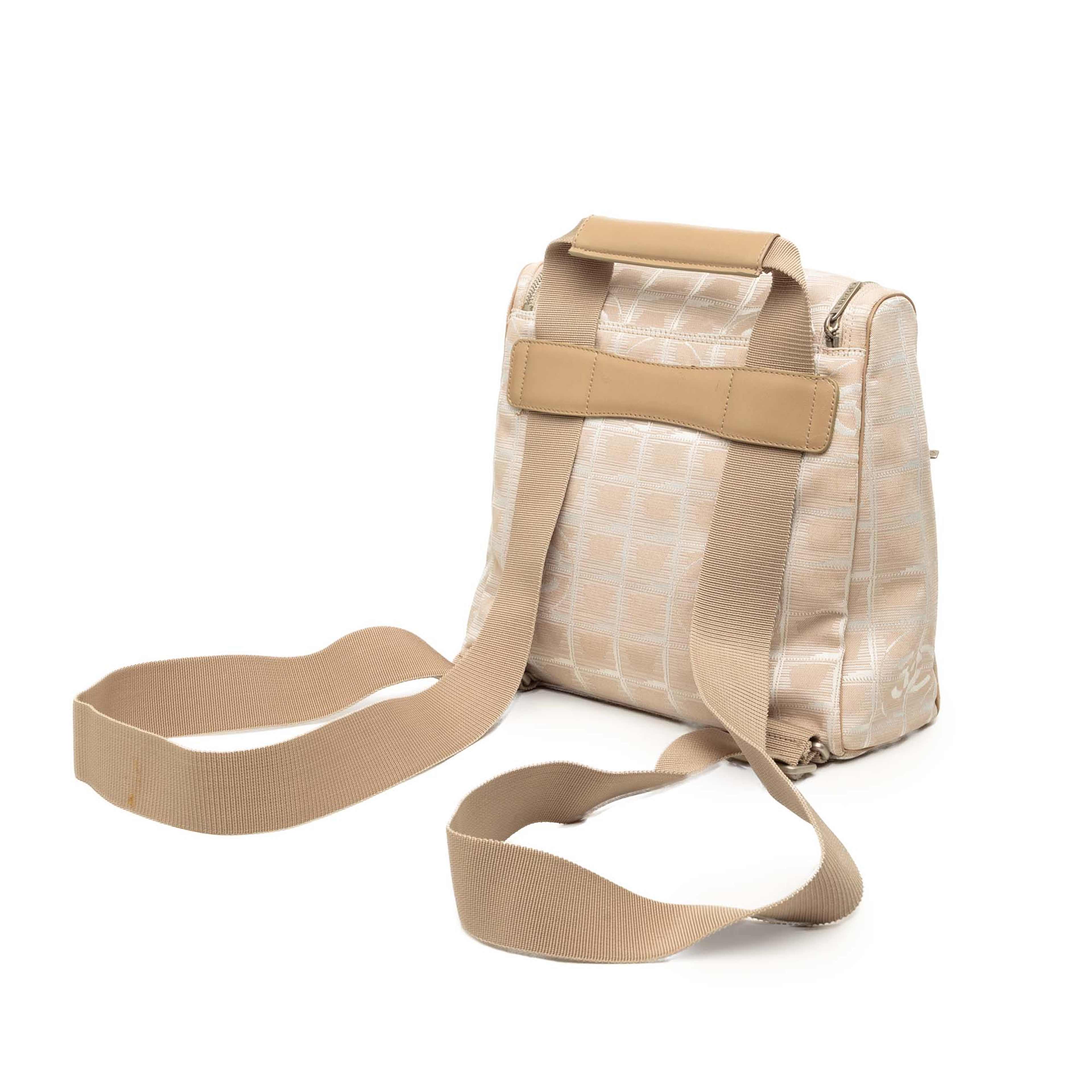 Chanel New Travel Line Nylon Backpack, från Luxclusif, i färgen beige. Klicka för att öppna bilden i stort format