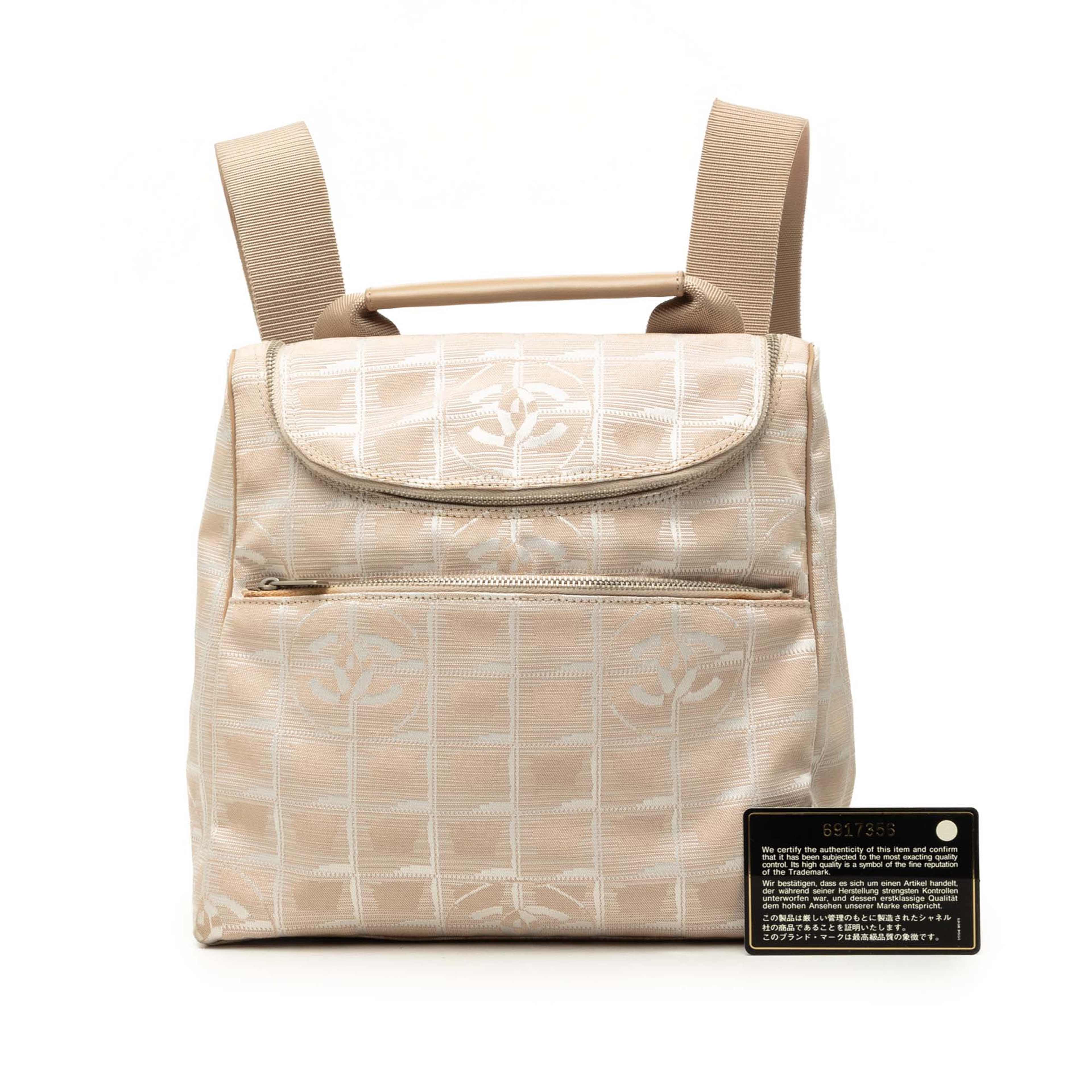 Chanel New Travel Line Nylon Backpack, från Luxclusif, i färgen beige. Klicka för att öppna bilden i stort format