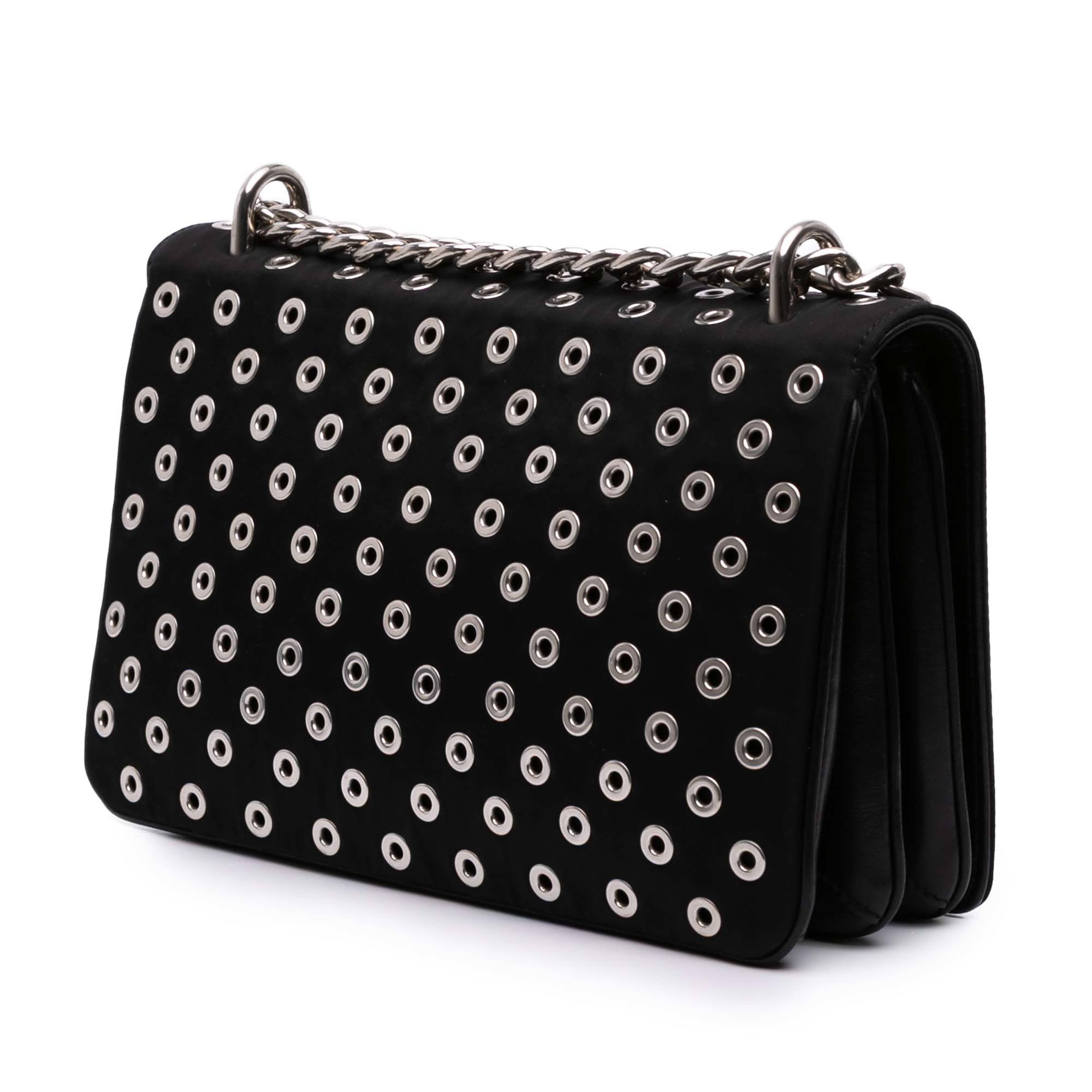 Prada Tessuto Grommet Crossbody, från Luxclusif, i färgen black. Klicka för att öppna bilden i stort format