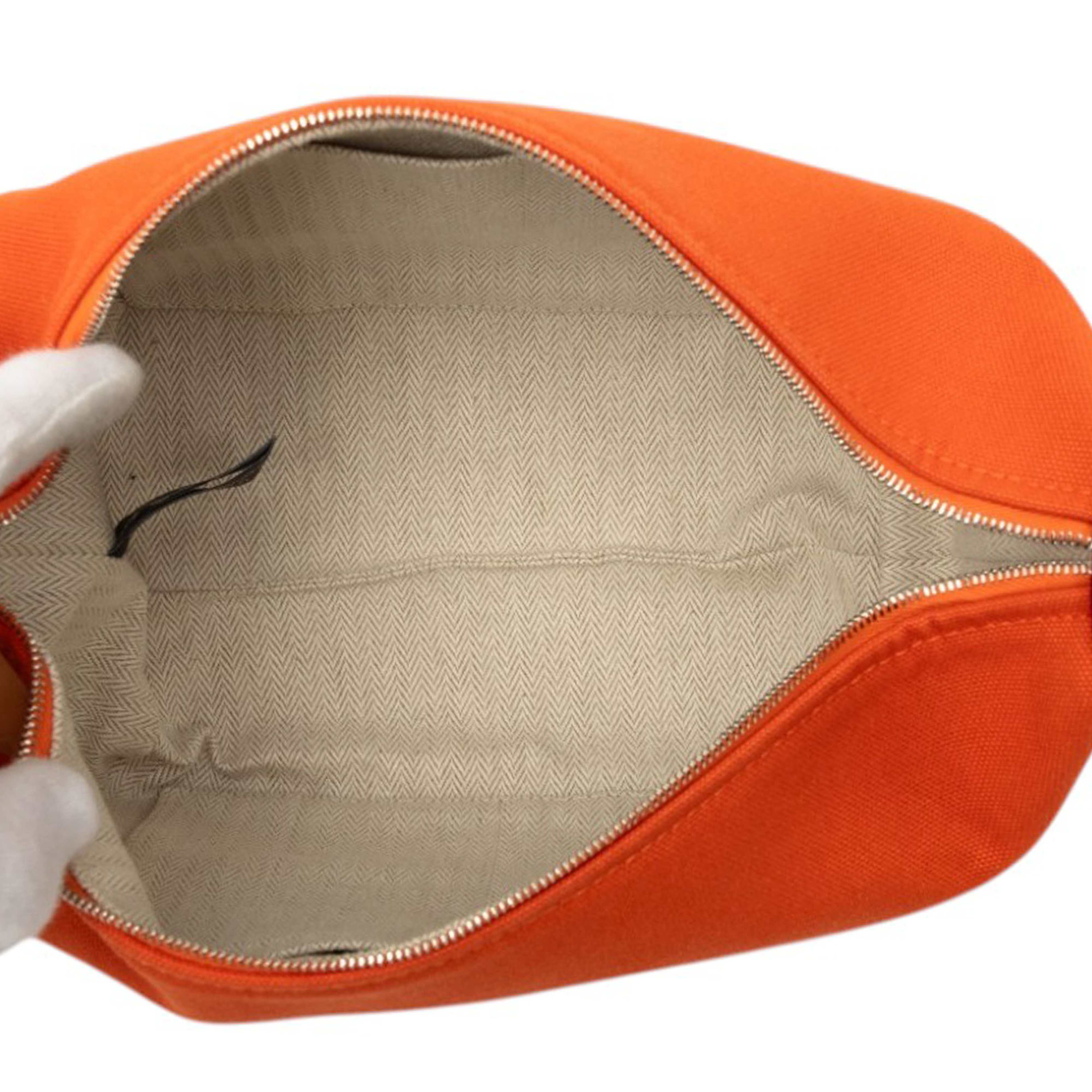 Hermès Small Toile Bride A Brac Case, från Luxclusif, i färgen orange. Klicka för att öppna bilden i stort format