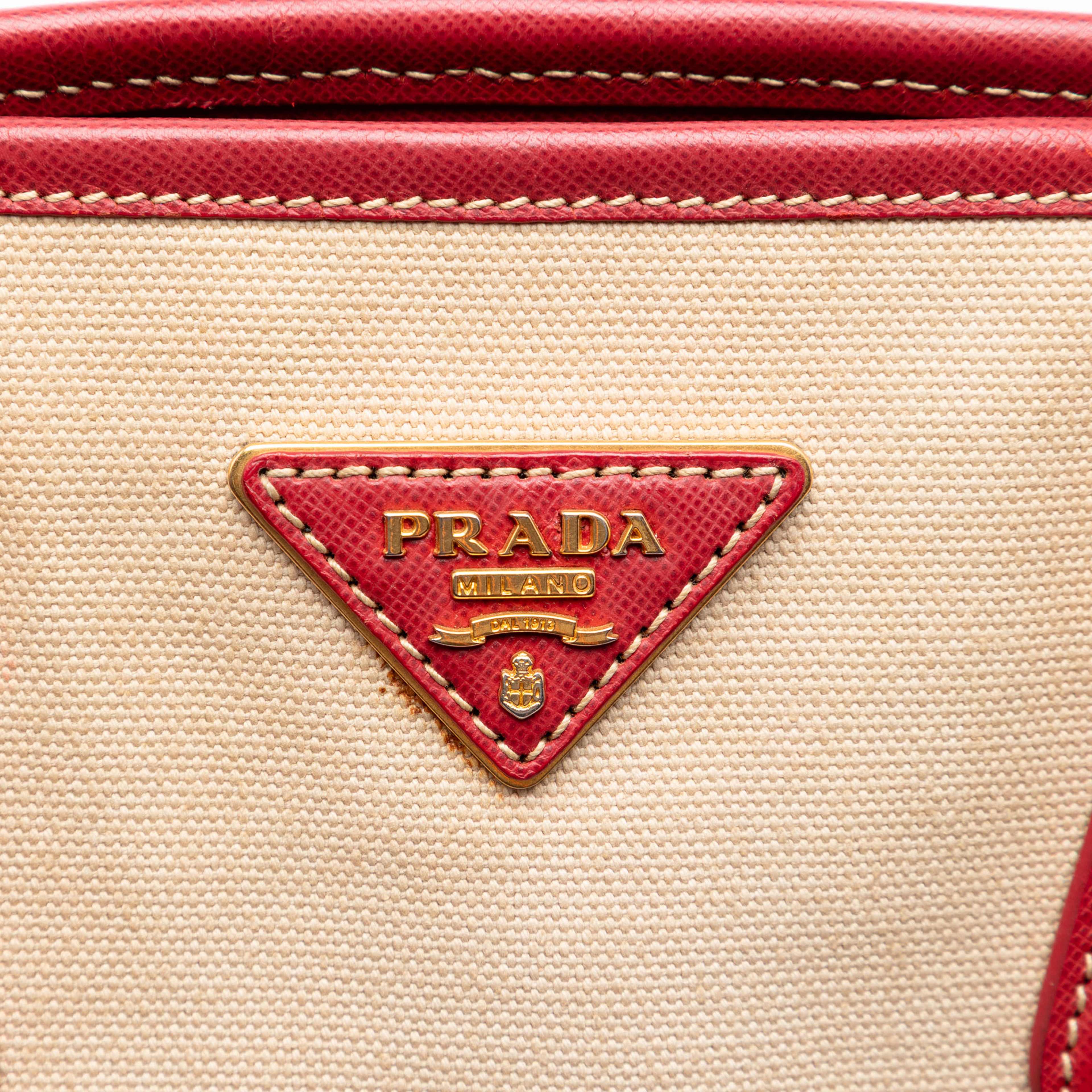 Prada Saffiano Trimmed Canvas Canapa Satchel, från Luxclusif, i färgen beige. Klicka för att öppna bilden i stort format