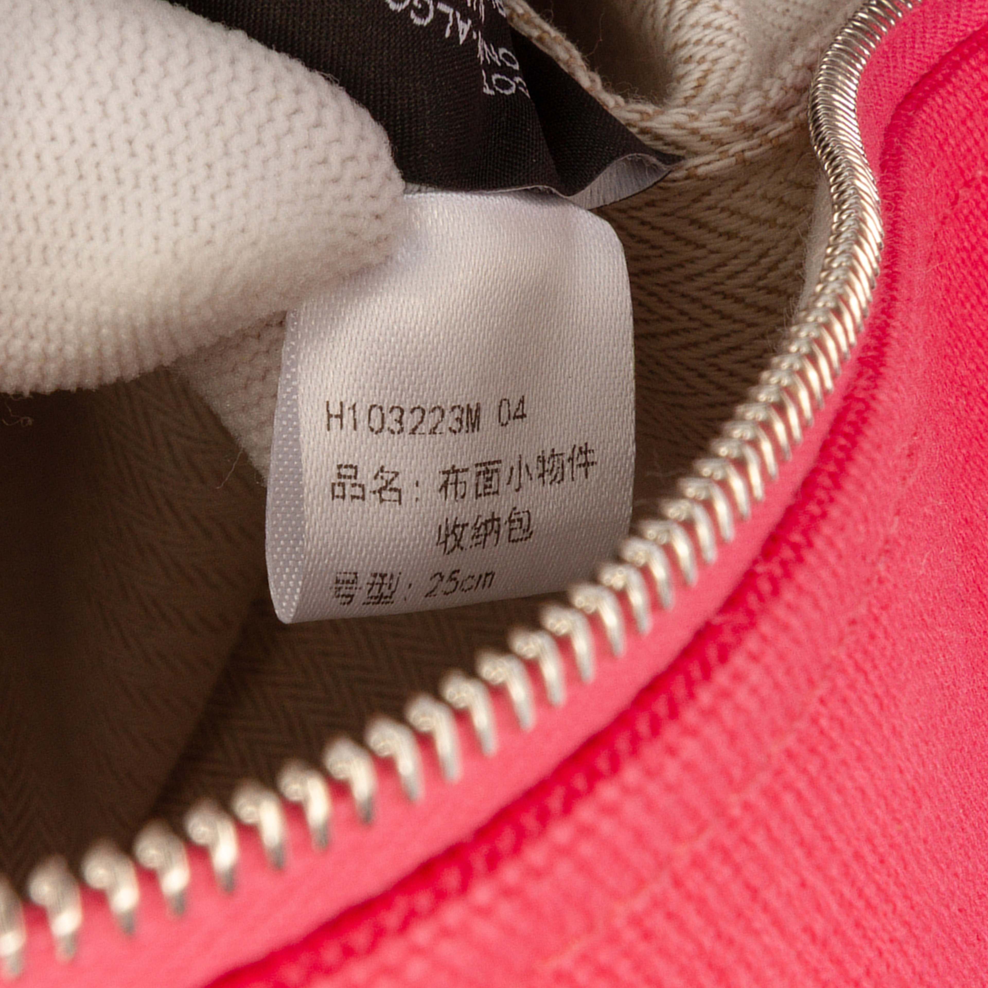 Hermès Large Toile Bride A Brac Case, från Luxclusif, i färgen hot pink. Klicka för att öppna bilden i stort format