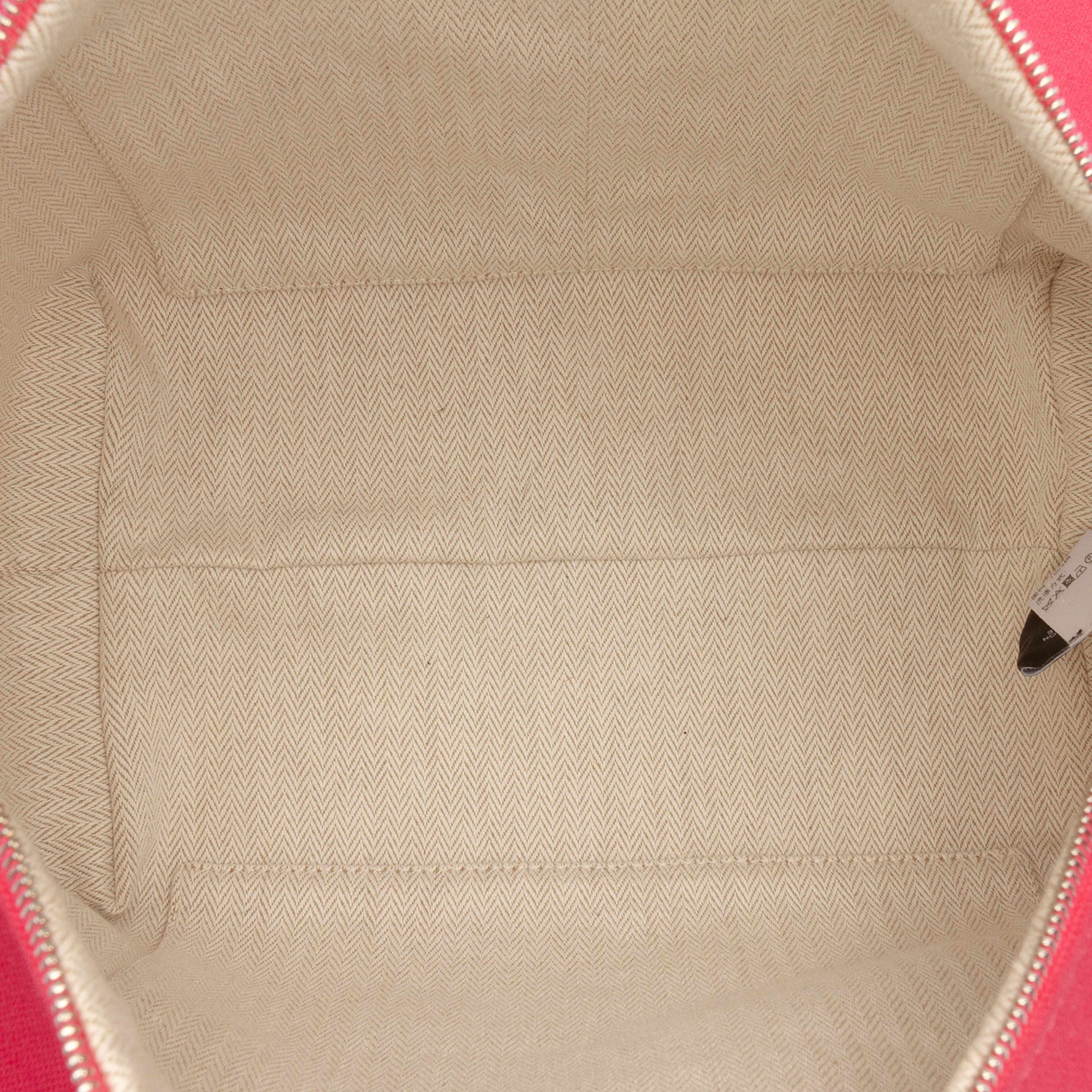 Hermès Large Toile Bride A Brac Case, från Luxclusif, i färgen hot pink. Klicka för att öppna bilden i stort format