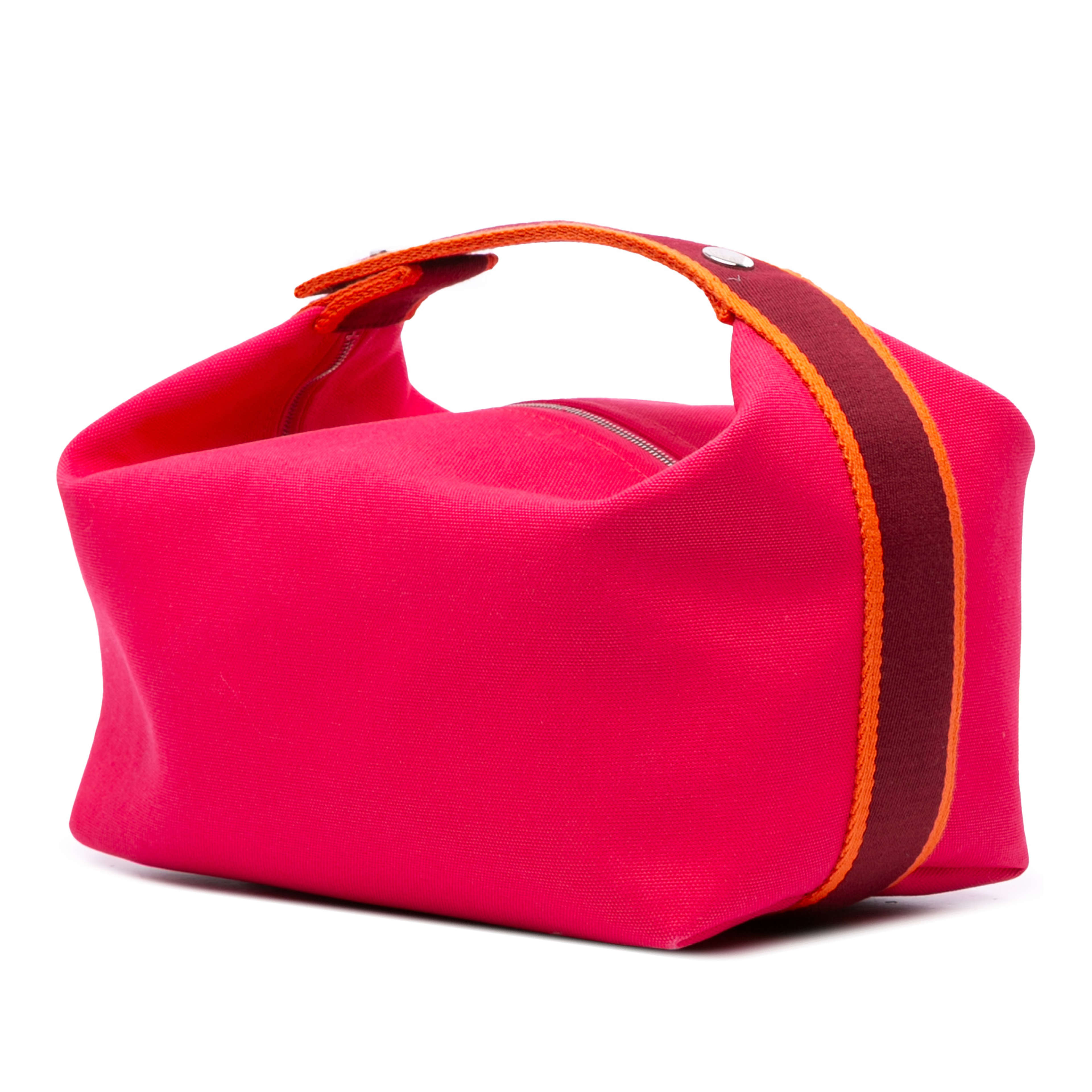 Hermès Large Toile Bride A Brac Case, från Luxclusif, i färgen hot pink. Klicka för att öppna bilden i stort format