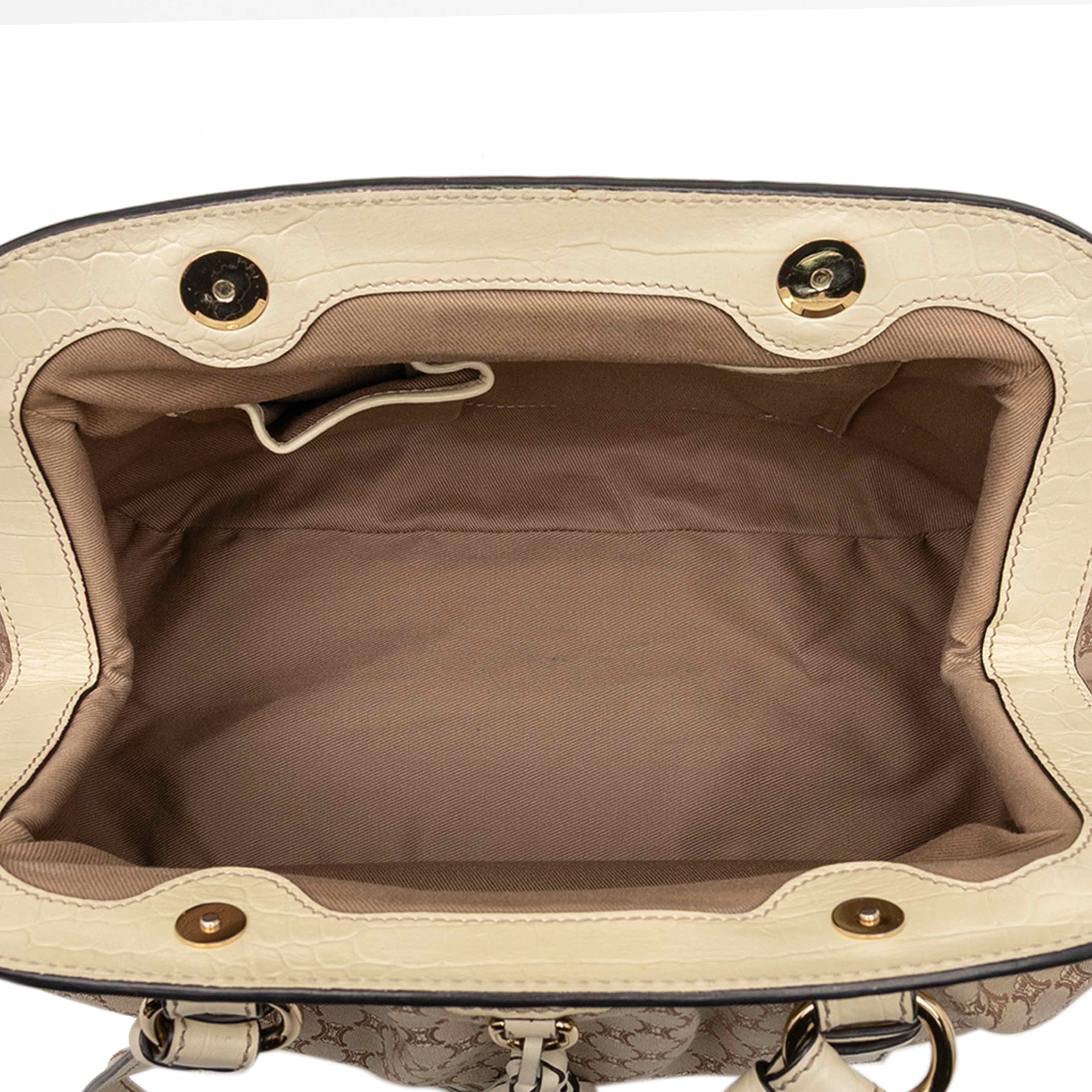 Celine Macadam Canvas Tassel Frame Satchel, från Luxclusif, i färgen beige. Klicka för att öppna bilden i stort format