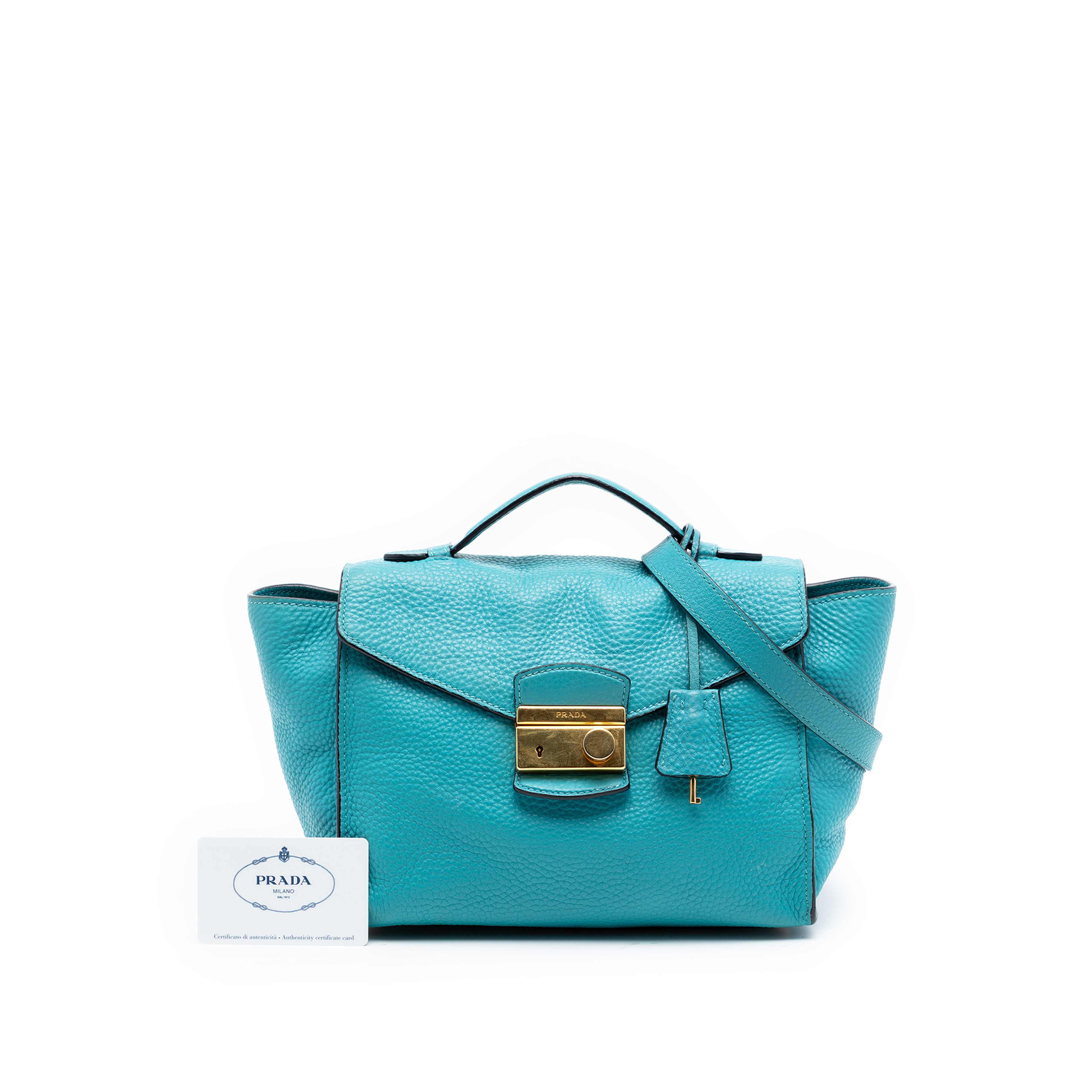 Prada Vitello Daino Sound Lock Satchel, från Luxclusif, i färgen blå. Klicka för att öppna bilden i stort format