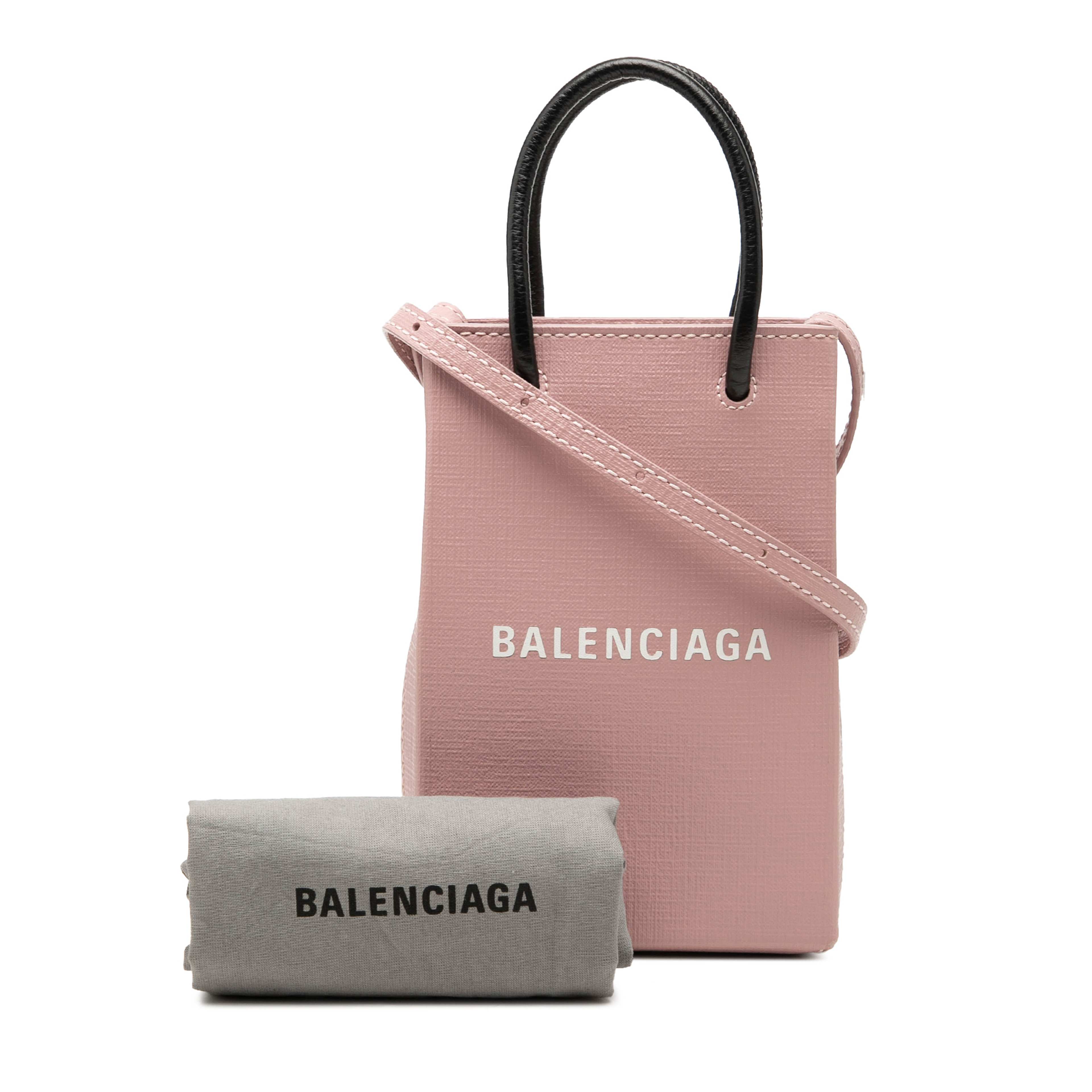 Balenciaga Mini Calfskin Logo Shopping Phone Holder, från Luxclusif, i färgen rosa. Klicka för att öppna bilden i stort format