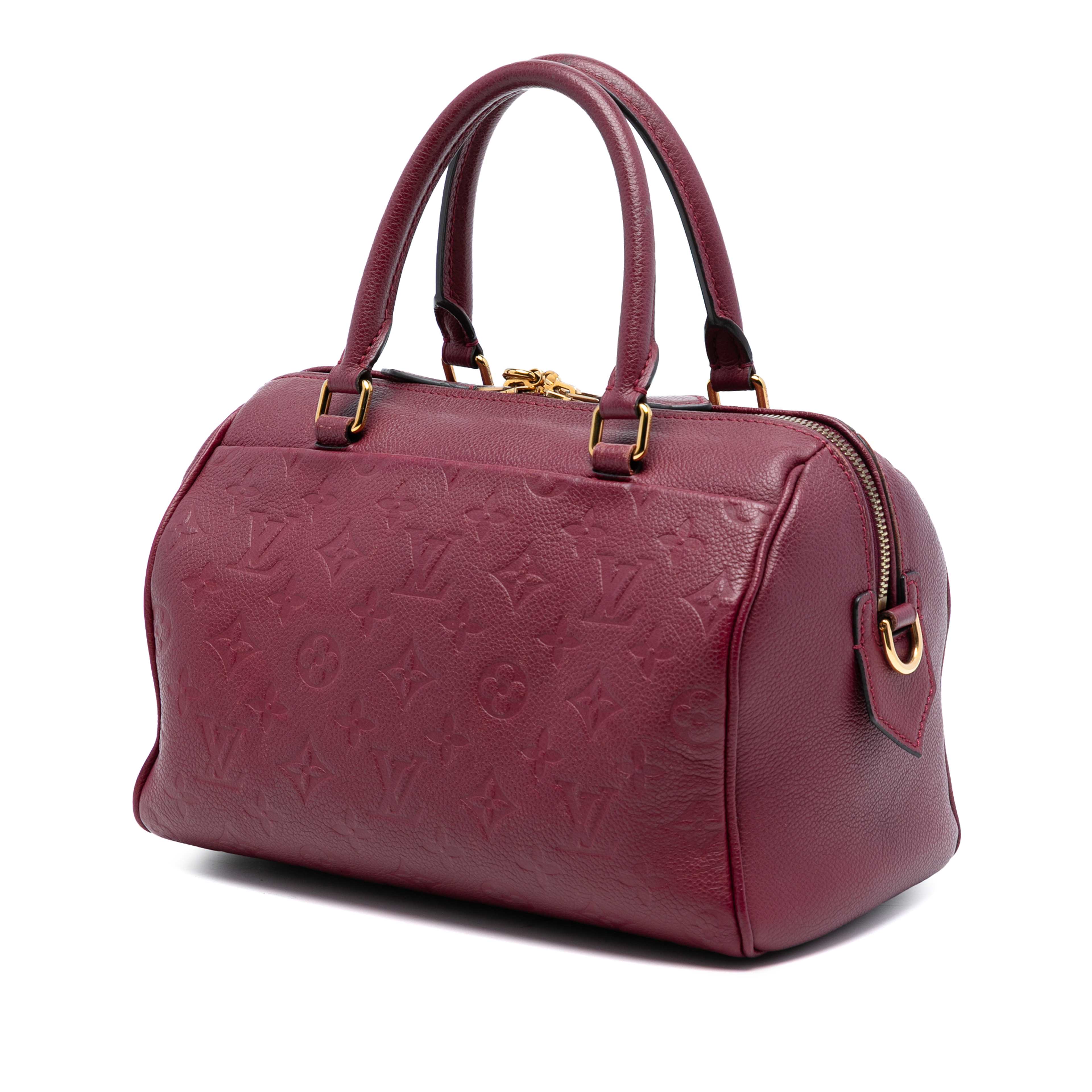 Louis Vuitton Monogram Empreinte Speedy Bandouliere 25, från Luxclusif, i färgen burgundy. Klicka för att öppna bilden i stort format