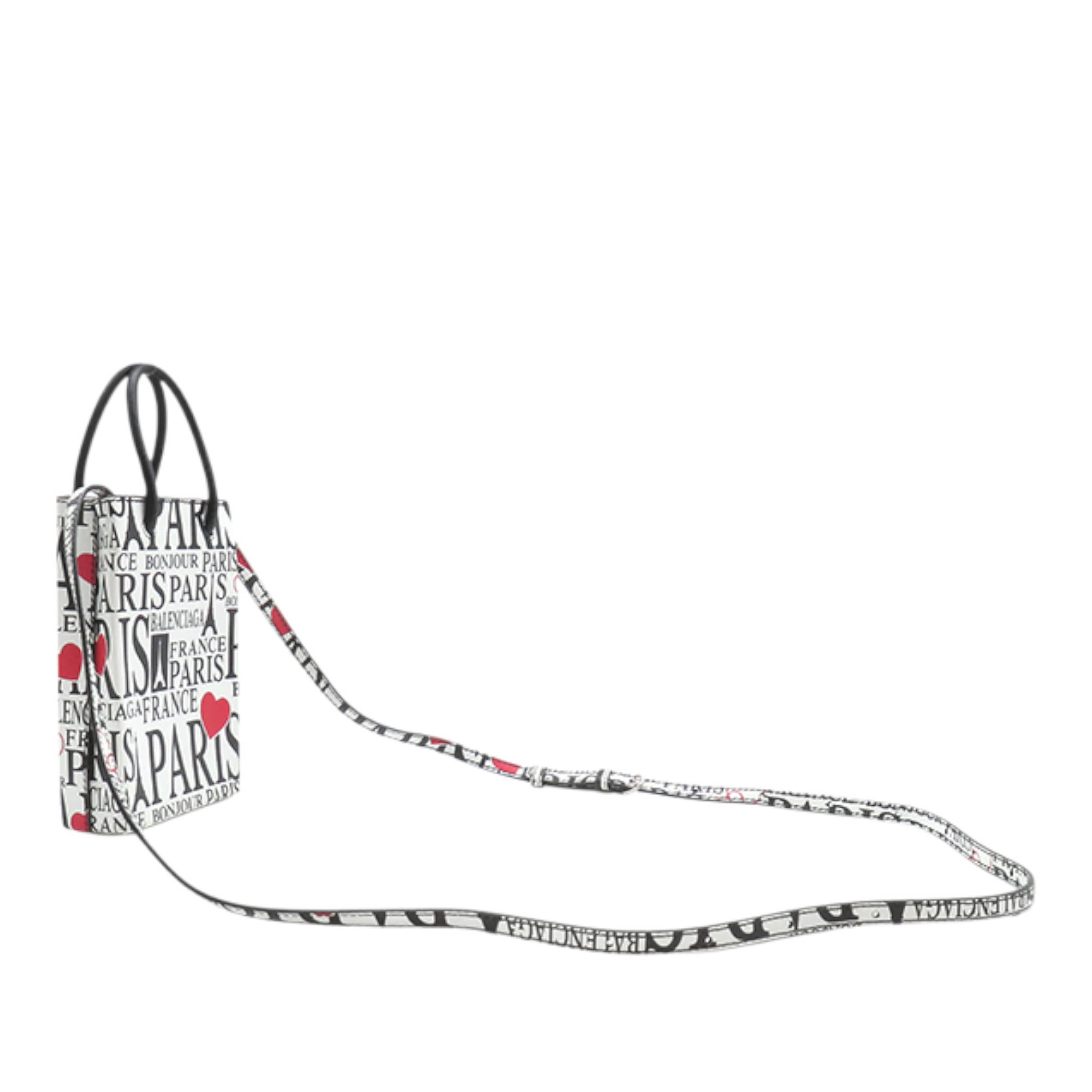 Balenciaga Mini Calfskin Bonjour Paris Shopping Phone Holder, från Luxclusif, i färgen white. Klicka för att öppna bilden i stort format