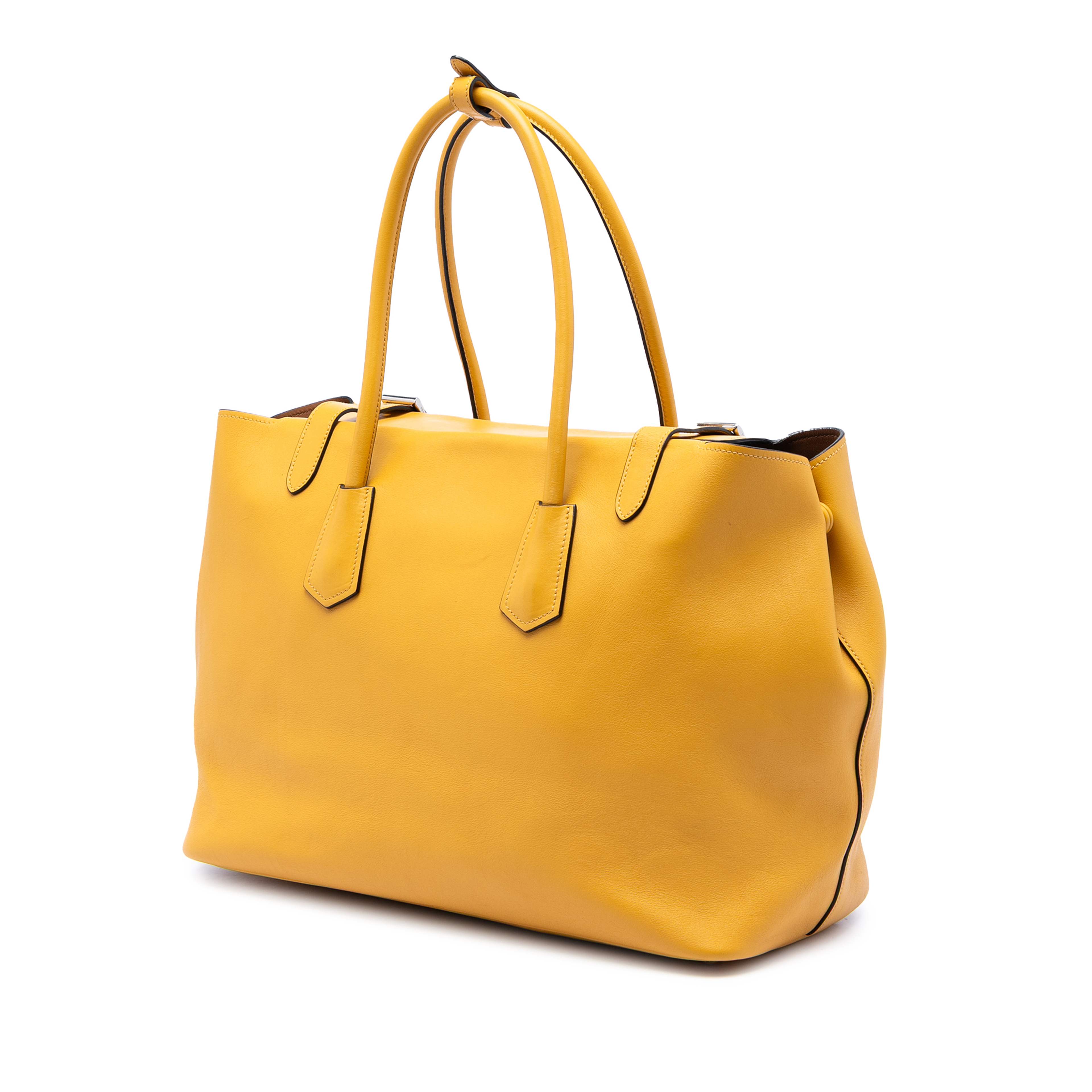 Prada City Calf Leather Buckle Tote, från Luxclusif, i färgen gul. Klicka för att öppna bilden i stort format