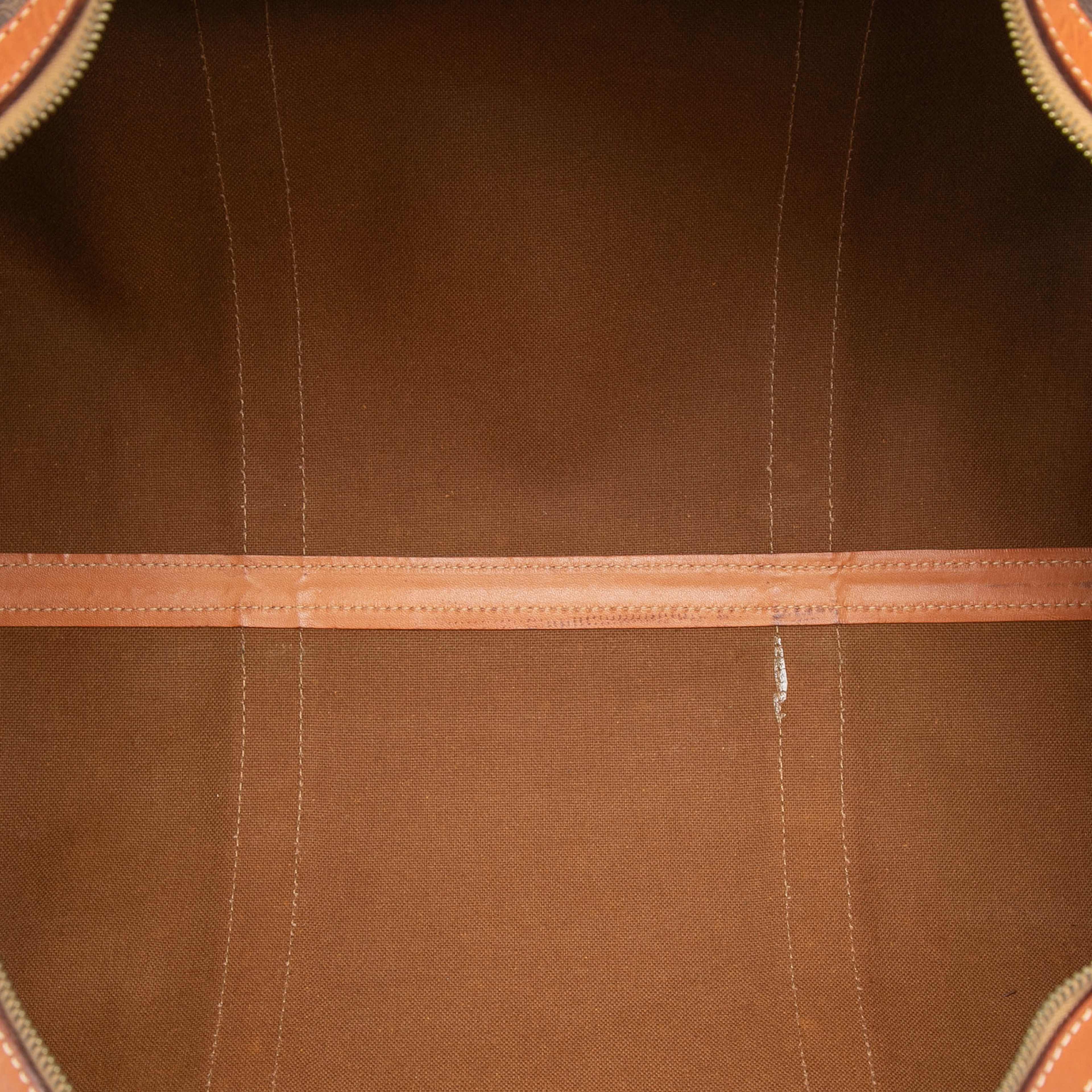 Celine Macadam Coated Canvas Travel Bag, från Luxclusif, i färgen brown. Klicka för att öppna bilden i stort format