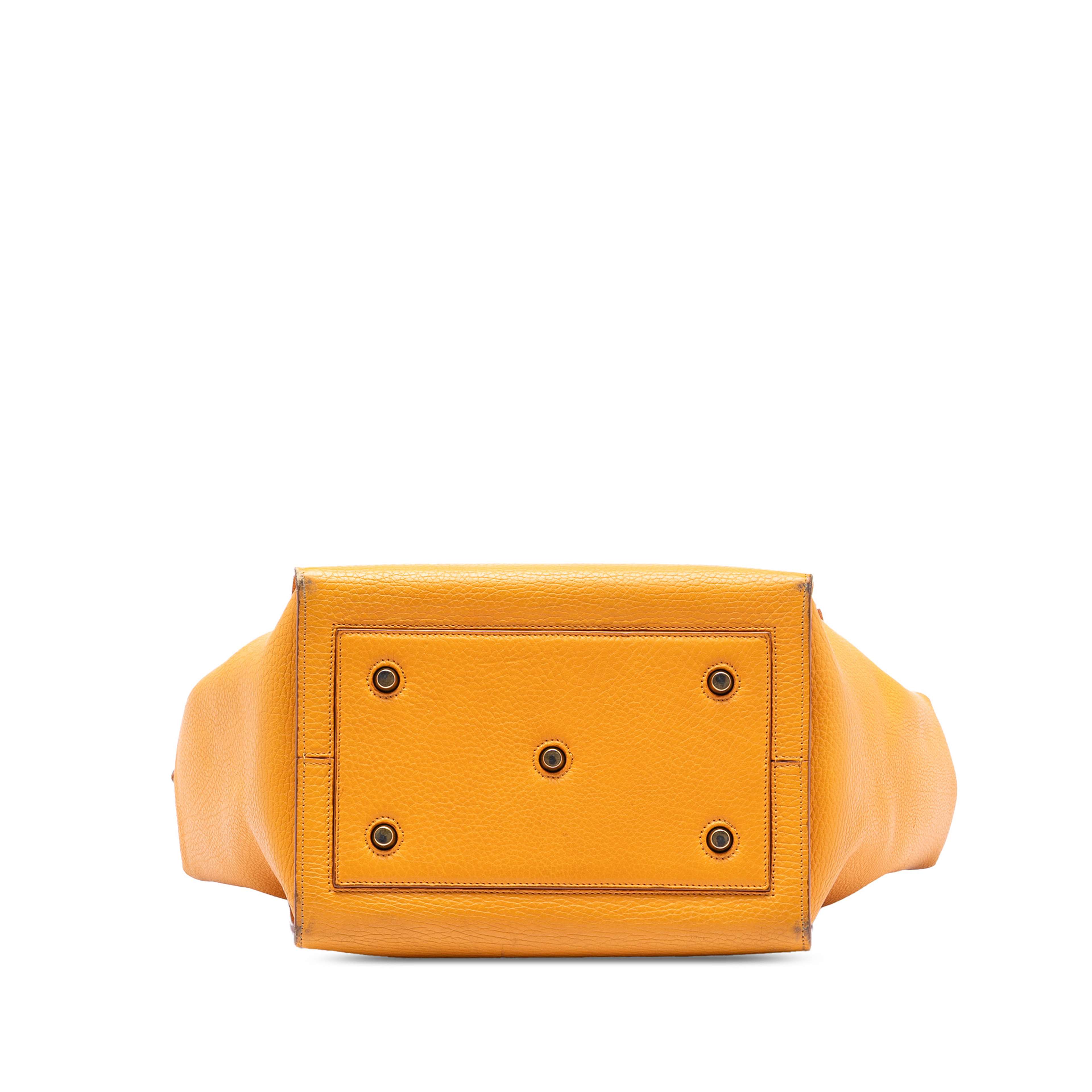 Celine Small Grained Calfskin Tie Knot Handbag, från Luxclusif, i färgen mustard. Klicka för att öppna bilden i stort format