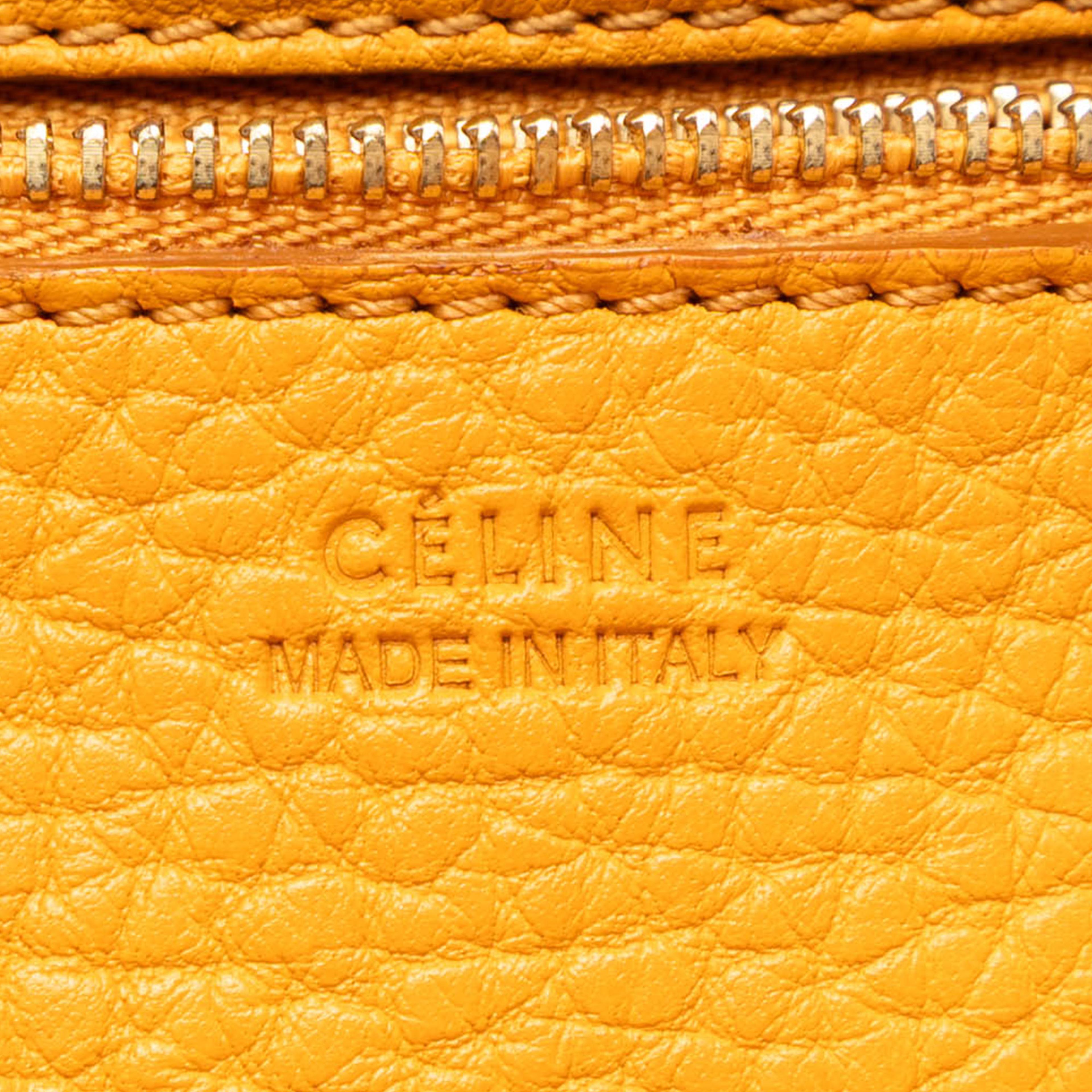 Celine Small Grained Calfskin Tie Knot Handbag, från Luxclusif, i färgen mustard. Klicka för att öppna bilden i stort format