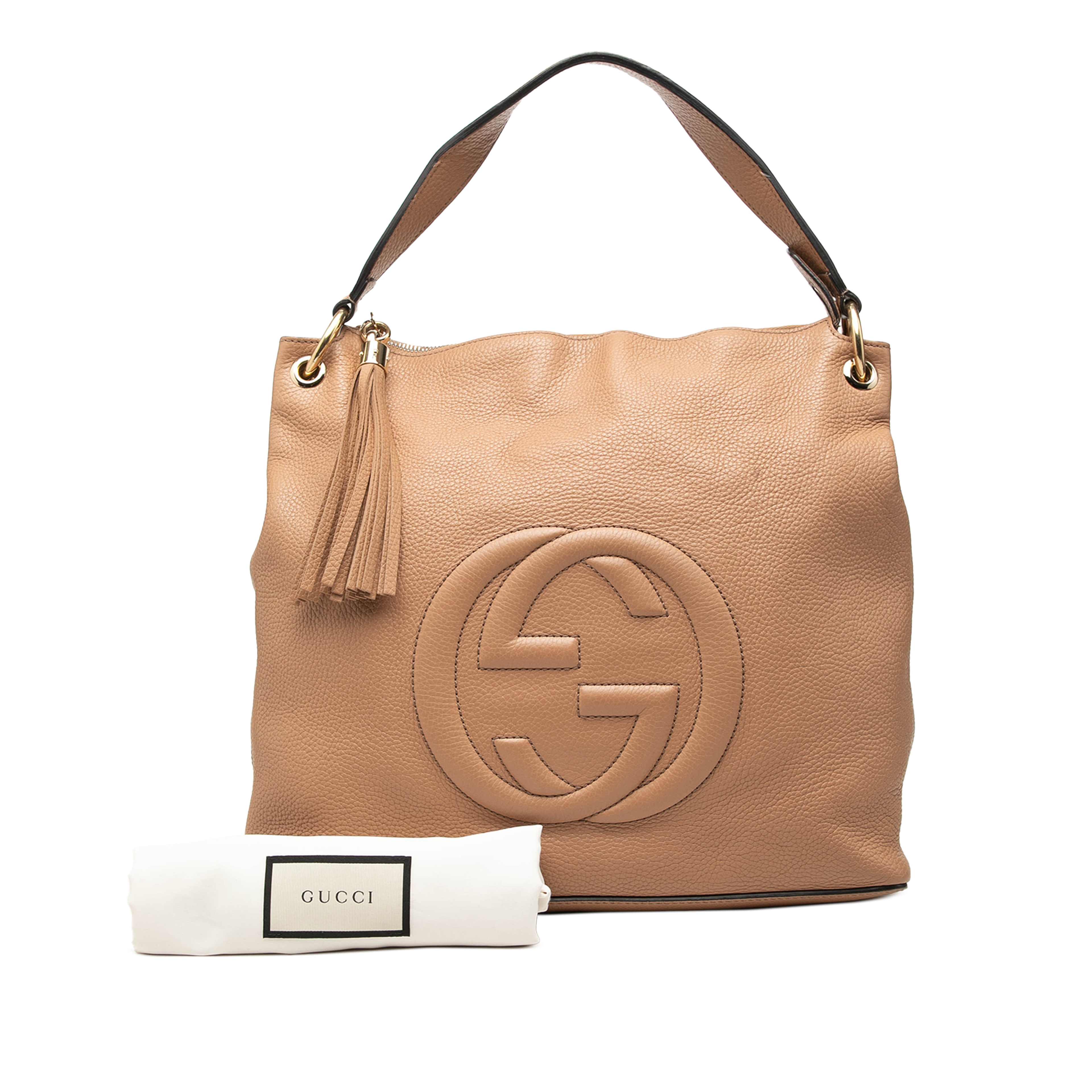 Gucci Large Pebbled Calfskin Soho Convertible Hobo, från Luxclusif, i färgen beige. Klicka för att öppna bilden i stort format